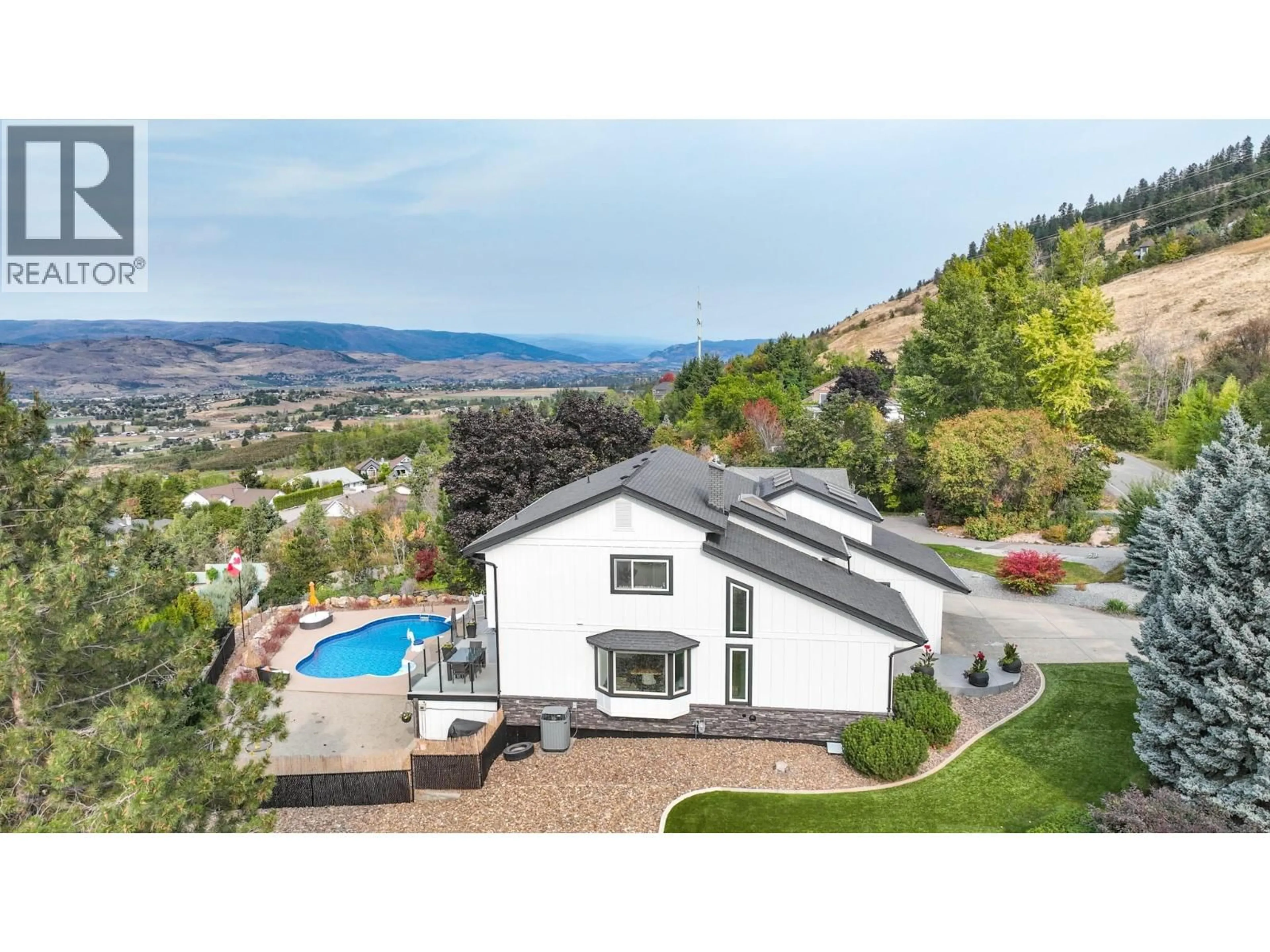 A pic from outside/outdoor area/front of a property/back of a property/a pic from drone, mountain view for 702 CYPRESS DRIVE, Coldstream British Columbia V1B2X9