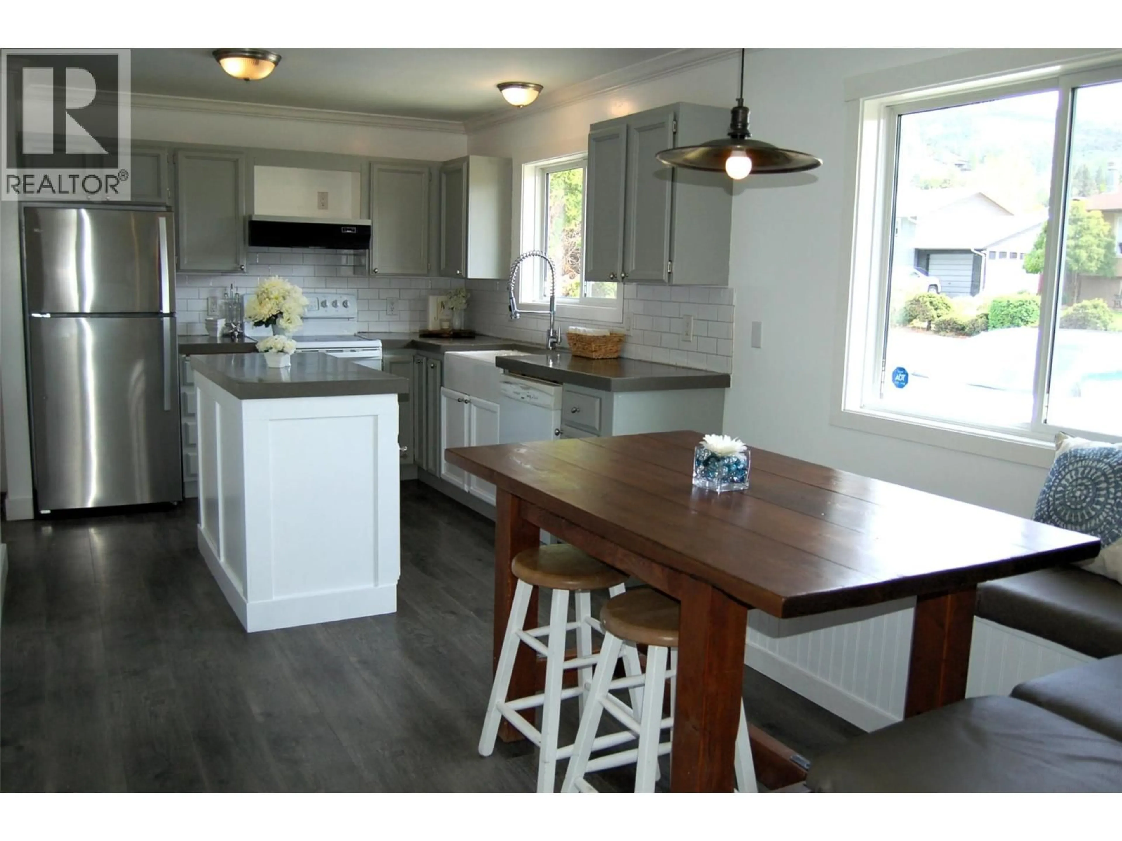 Open concept kitchen, wood/laminate floor for 103 CLELAND DRIVE, Penticton British Columbia V2A7H4