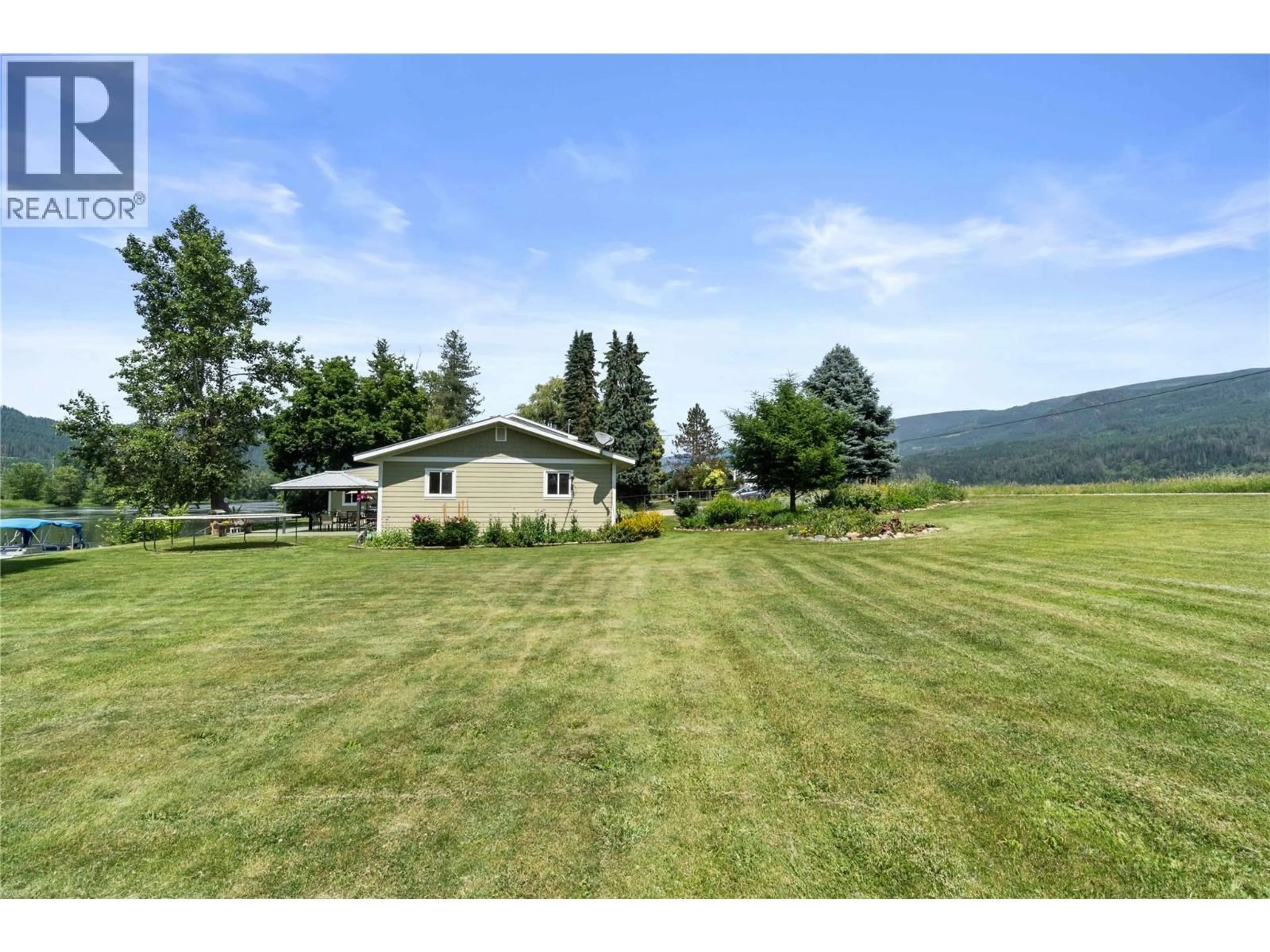 A pic from outside/outdoor area/front of a property/back of a property/a pic from drone, mountain view for 7088 97A HIGHWAY, Grindrod British Columbia V0E1Y0