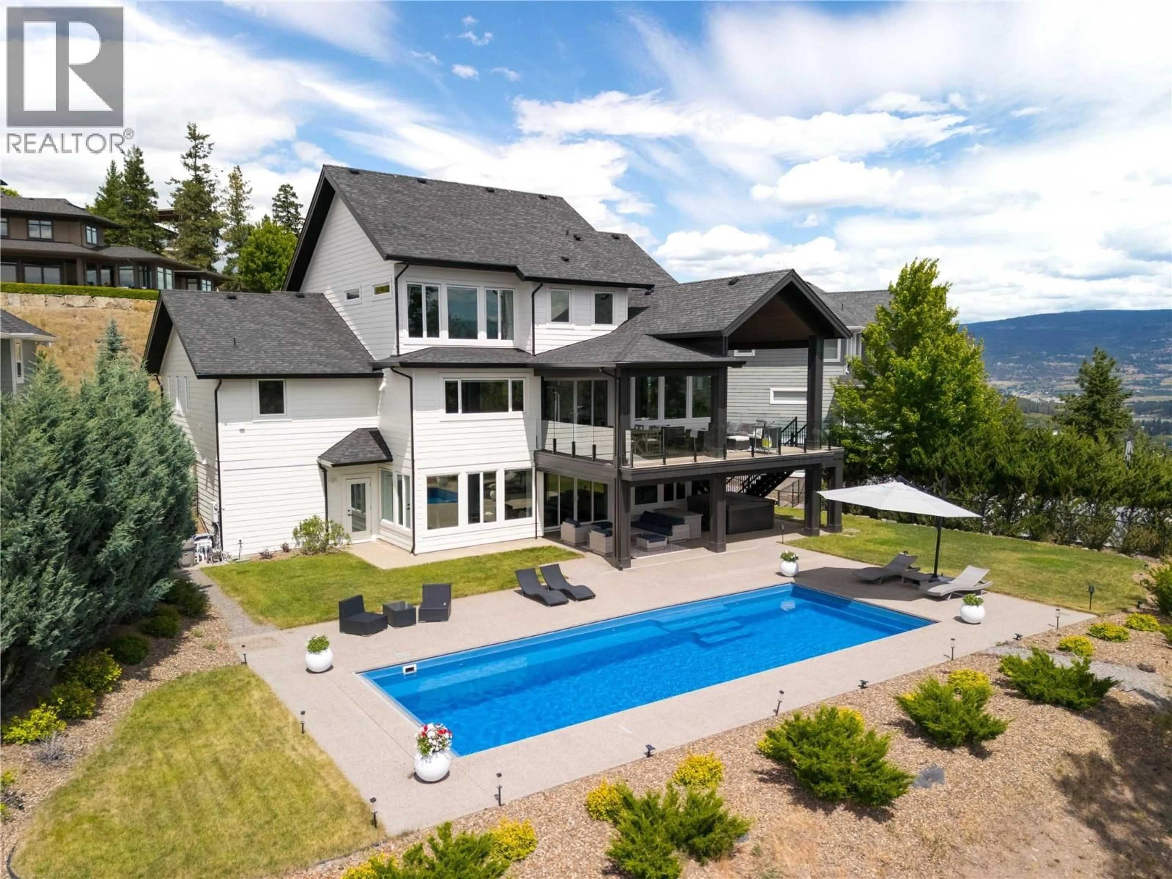 A pic from outside/outdoor area/front of a property/back of a property/a pic from drone, mountain view for 172 SKYLAND DRIVE, Kelowna British Columbia V1V3A1