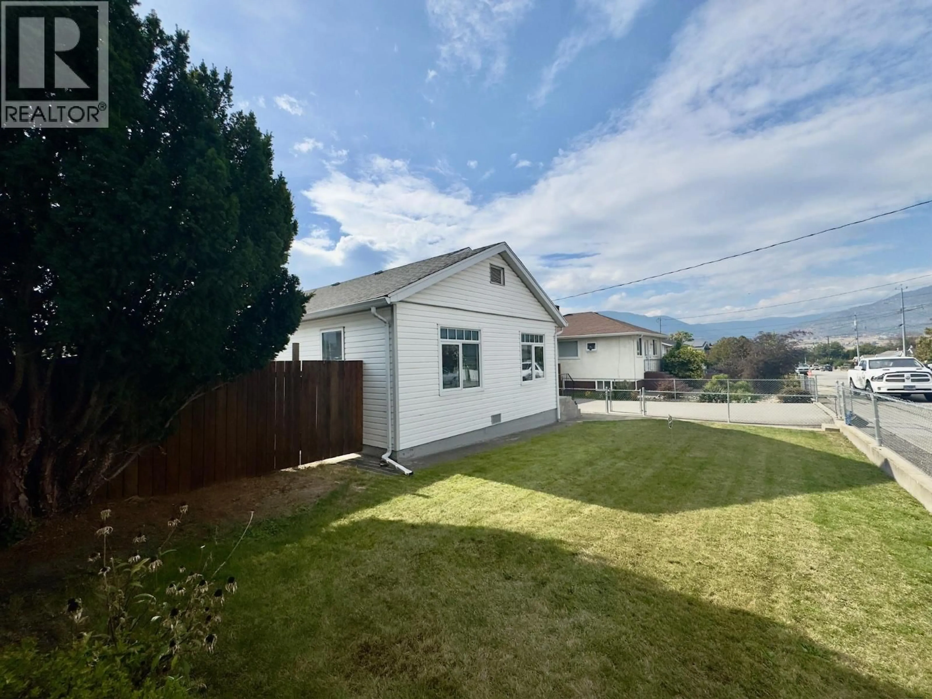 A pic from outside/outdoor area/front of a property/back of a property/a pic from drone, street for 584 EDNA AVENUE, Penticton British Columbia V2A2M2