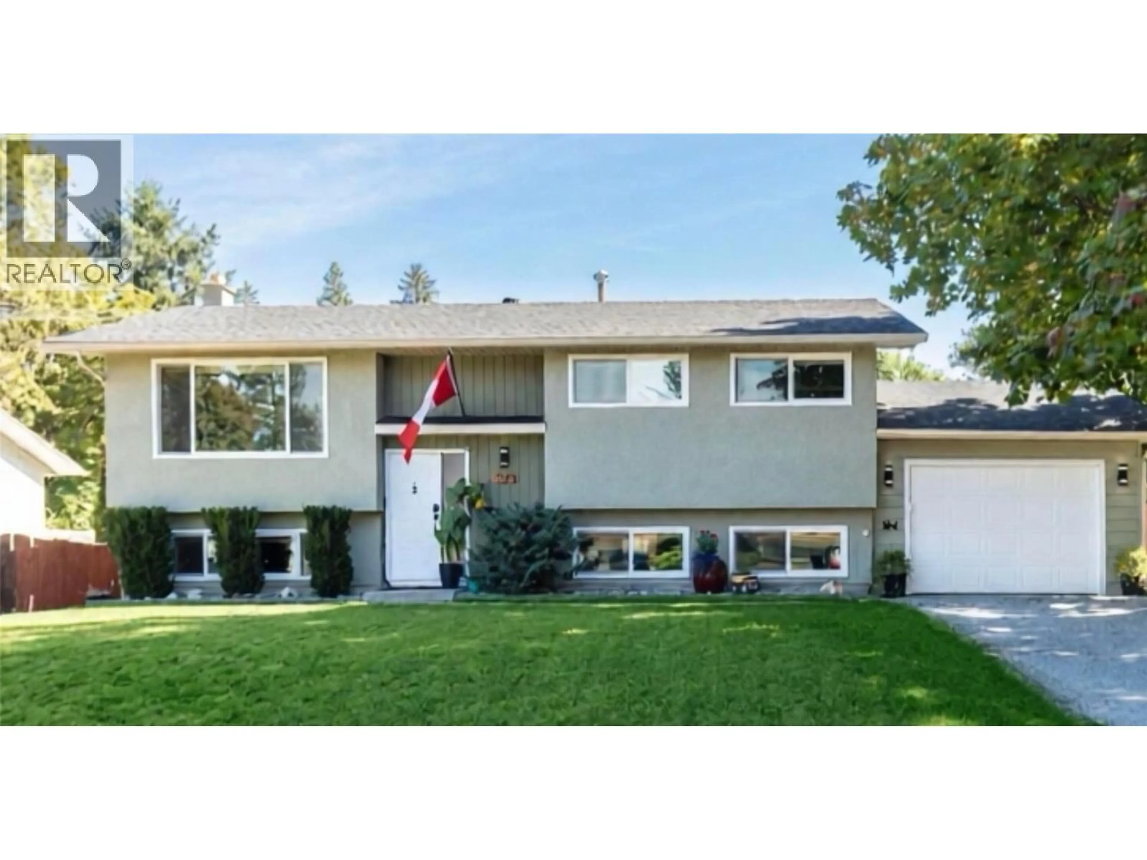 Home with vinyl exterior material, street for 7901 GILES DRIVE, Coldstream British Columbia V1B1G6
