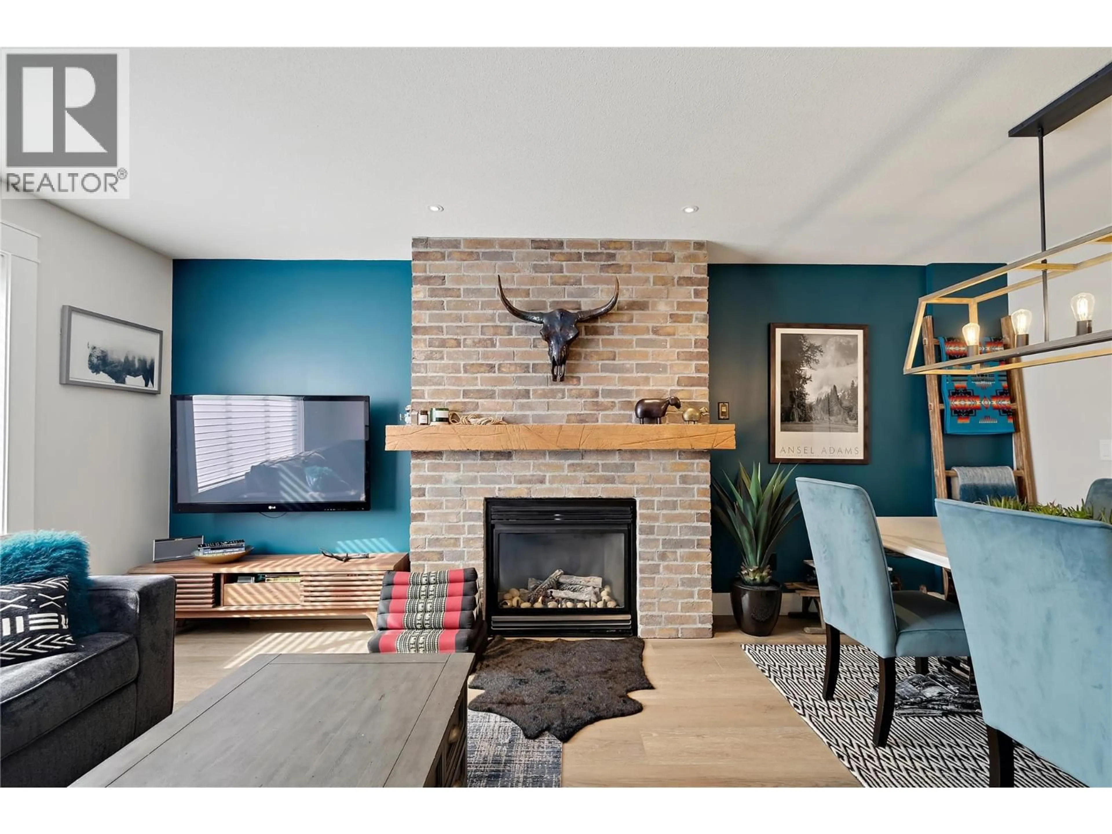 Living room with furniture, wood/laminate floor for 12 - 5350 BIG WHITE ROAD, Big White British Columbia V1P1P3