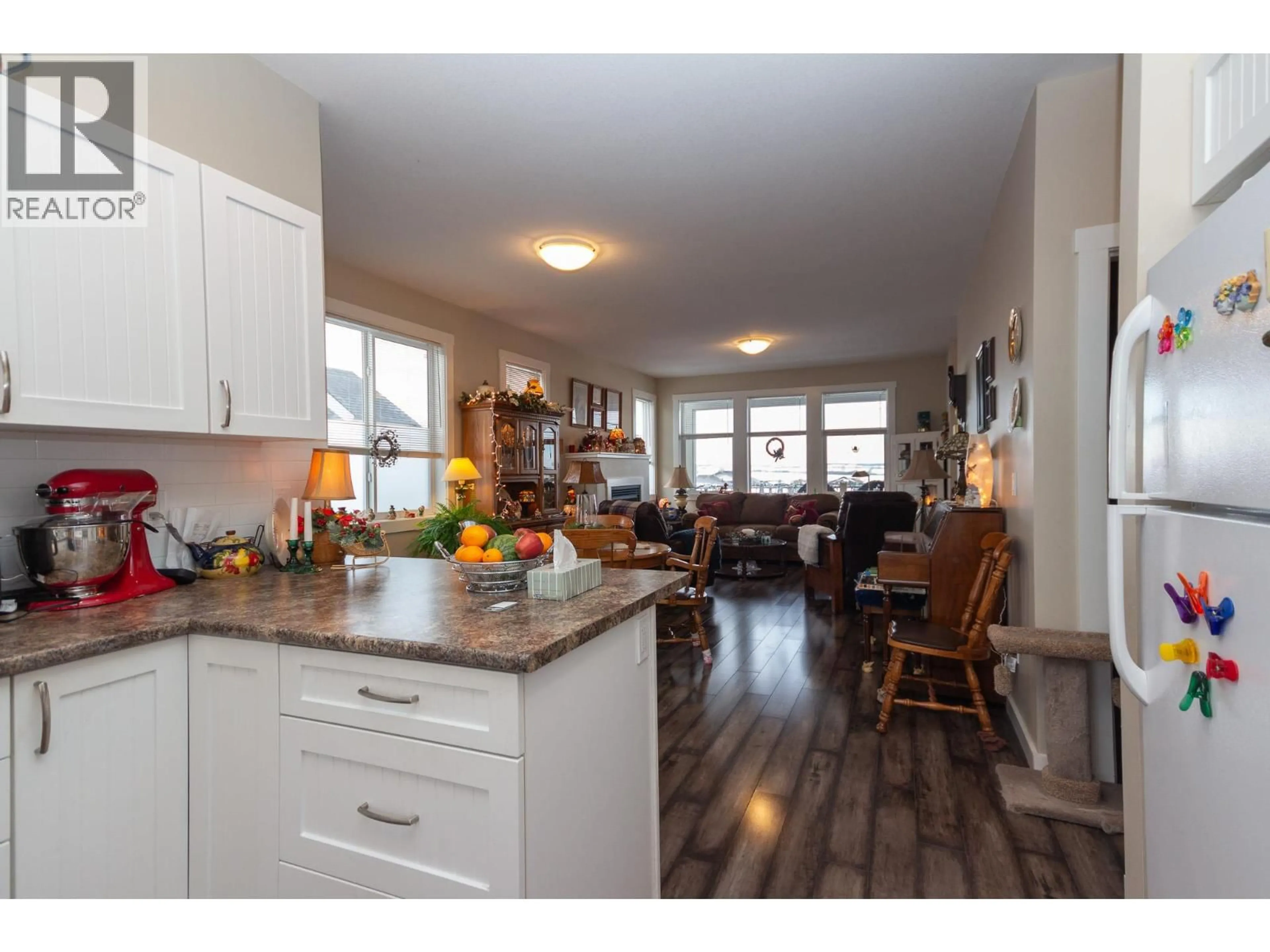 Open concept kitchen, wood/laminate floor for 8804 17 STREET, Dawson Creek British Columbia V1G0H2