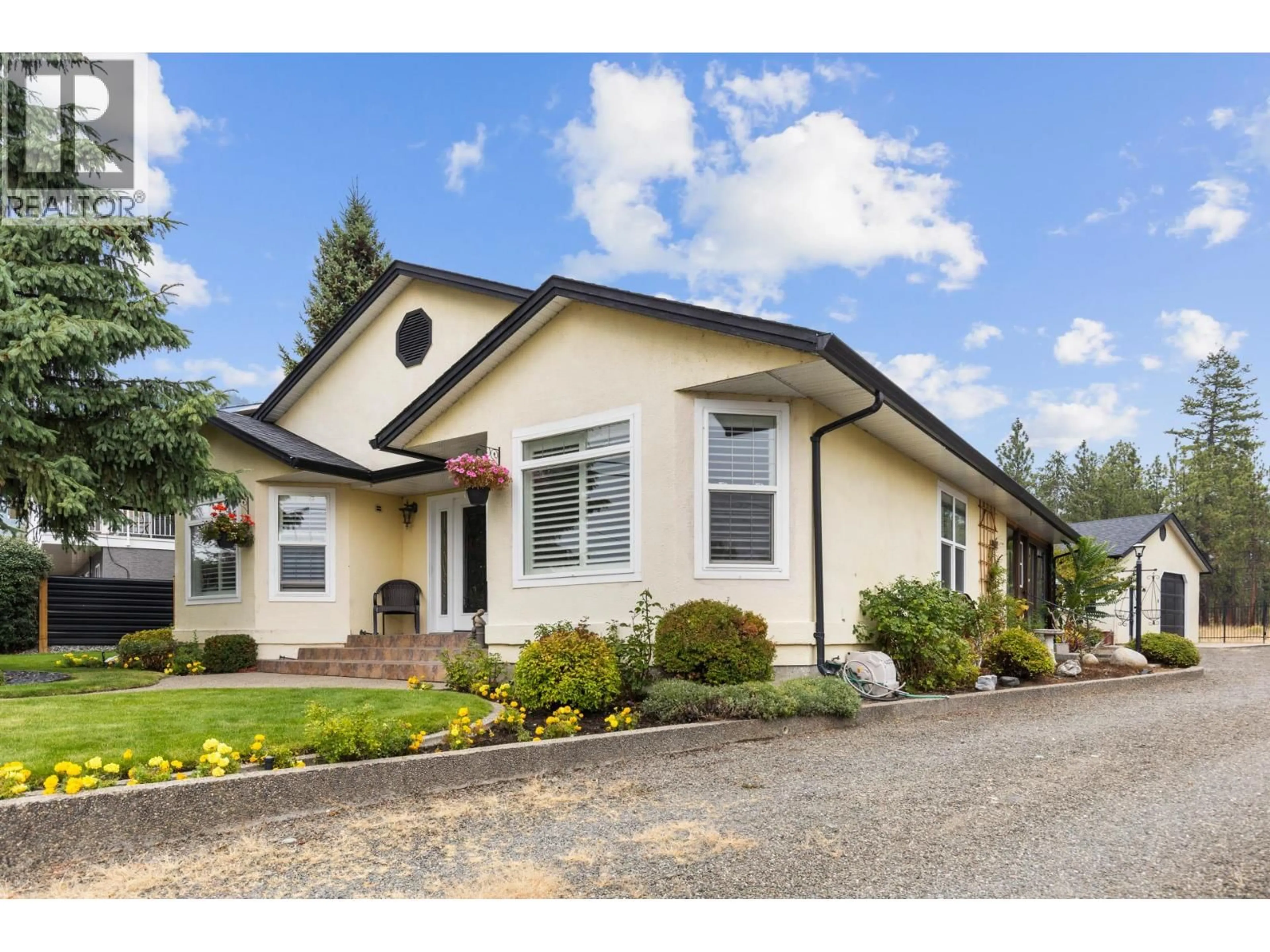 Home with vinyl exterior material, street for 4188 6 AVENUE, Peachland British Columbia V0H1X5