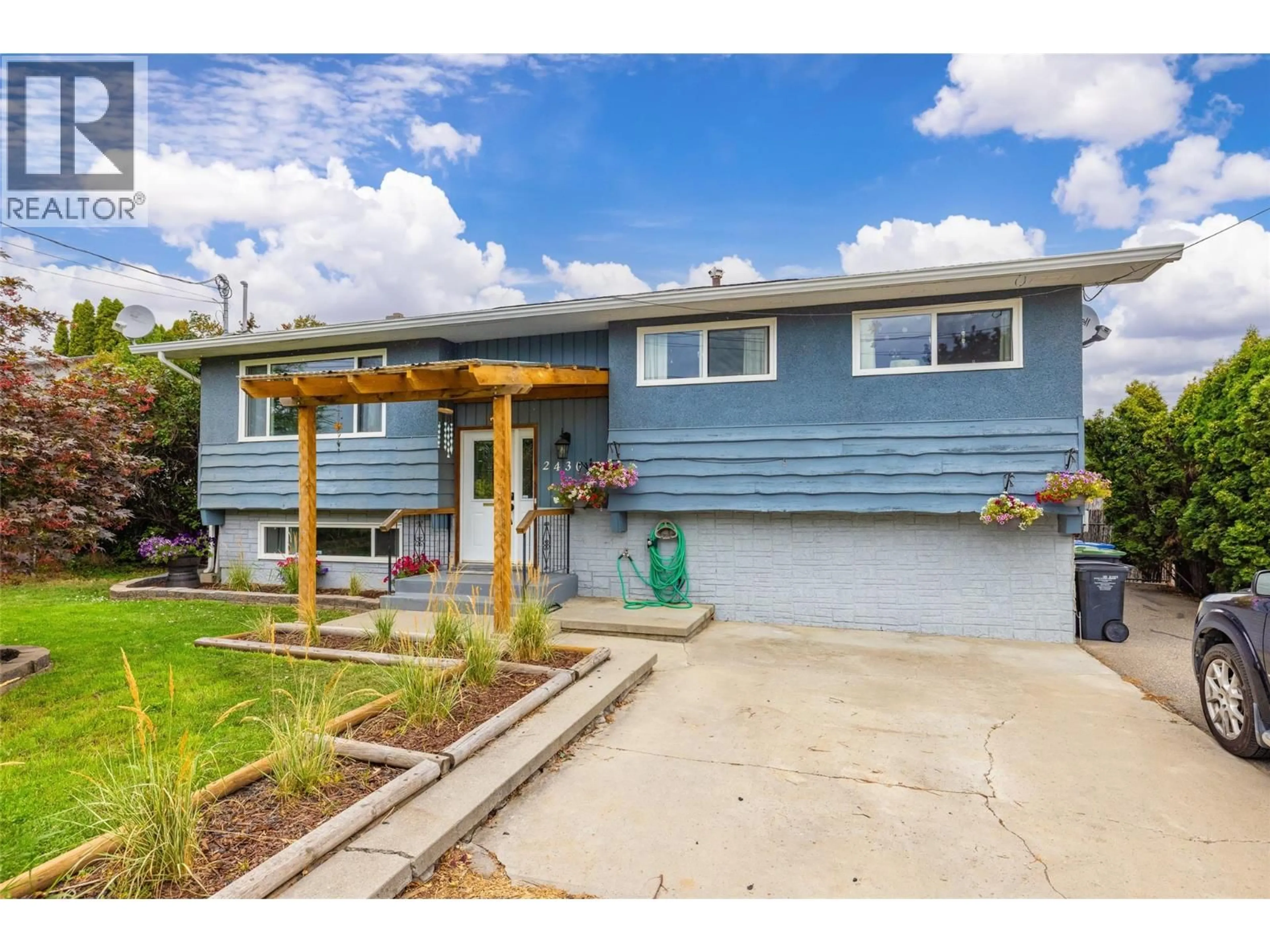 Home with vinyl exterior material, street for 2430 APOLLO ROAD, West Kelowna British Columbia V4T1P6