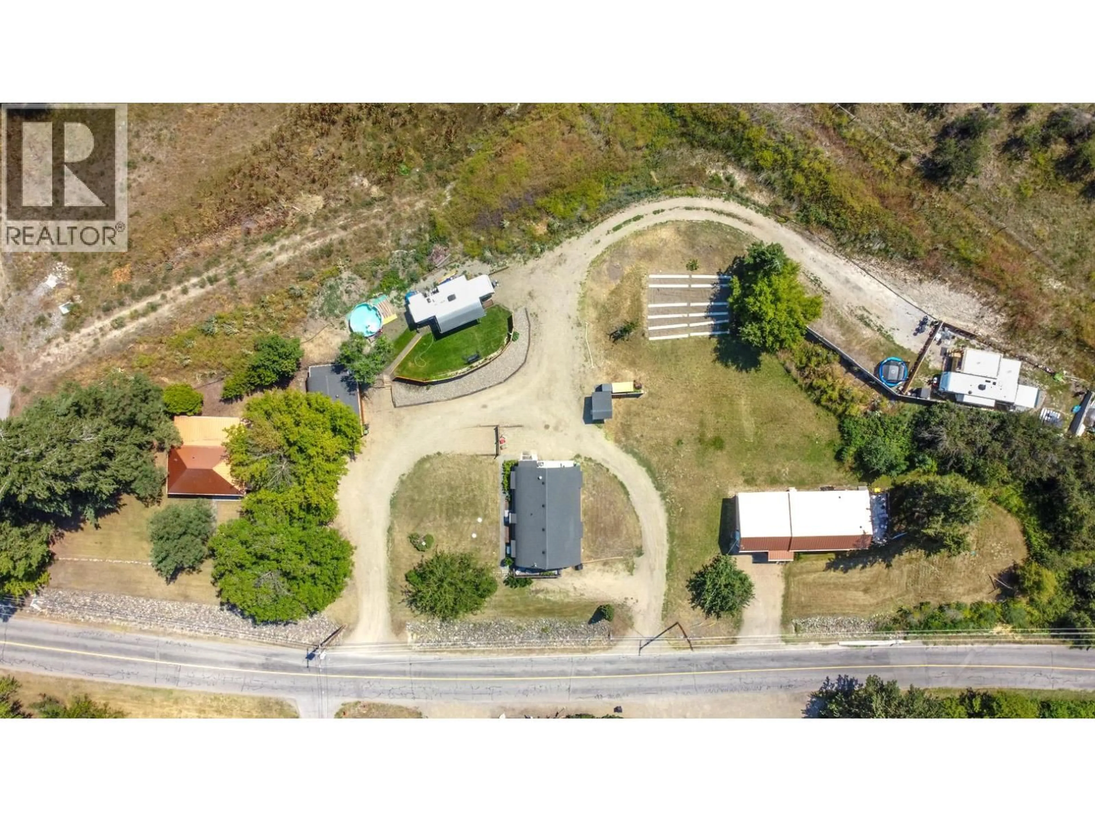 A pic from outside/outdoor area/front of a property/back of a property/a pic from drone, street for 6226 OKANAGAN AVENUE, Vernon British Columbia V1H1M1