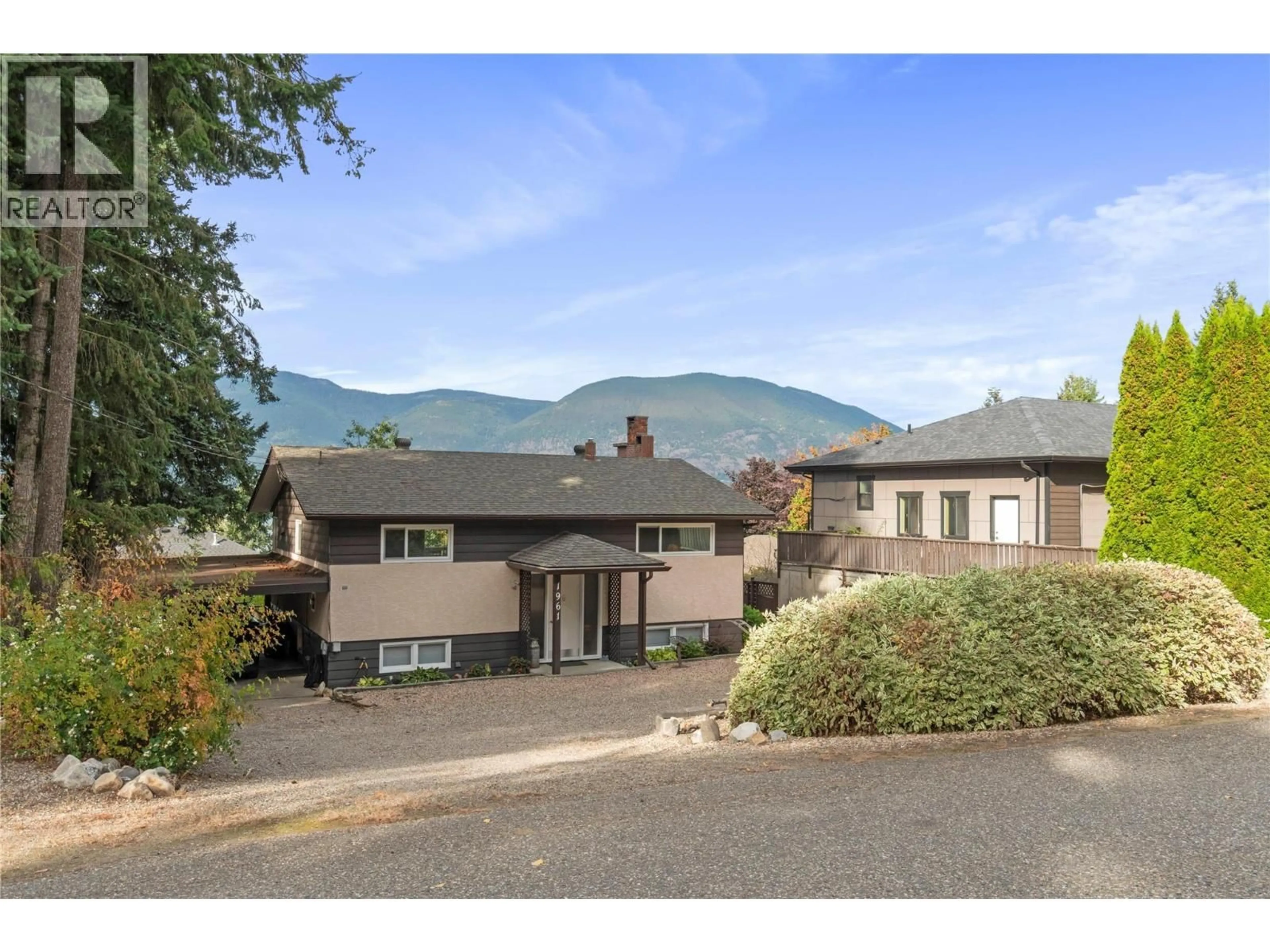 A pic from outside/outdoor area/front of a property/back of a property/a pic from drone, mountain view for 1961 17 STREET NORTHEAST, Salmon Arm British Columbia V1E3Z4