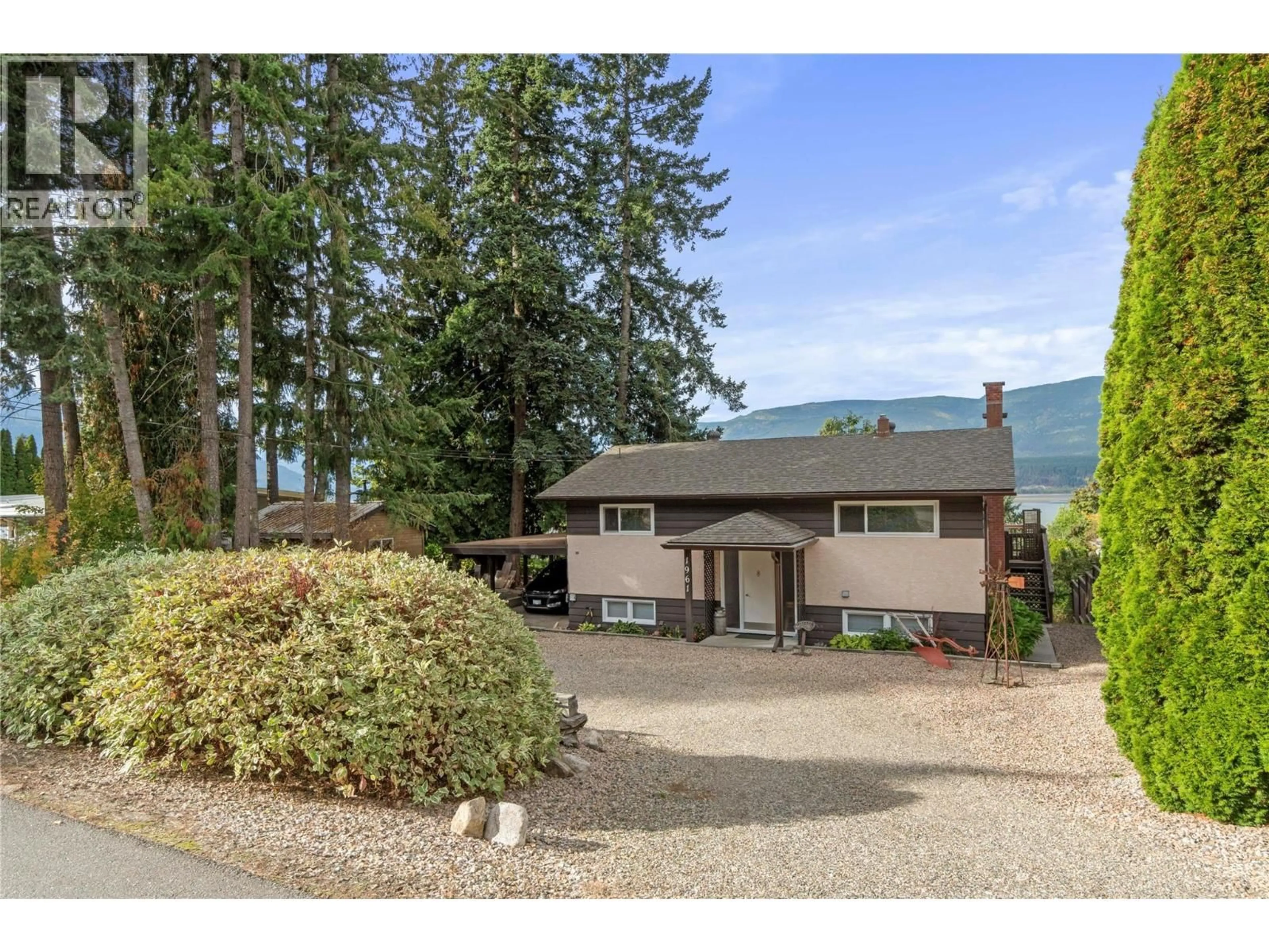 A pic from outside/outdoor area/front of a property/back of a property/a pic from drone, mountain view for 1961 17 STREET NORTHEAST, Salmon Arm British Columbia V1E3Z4