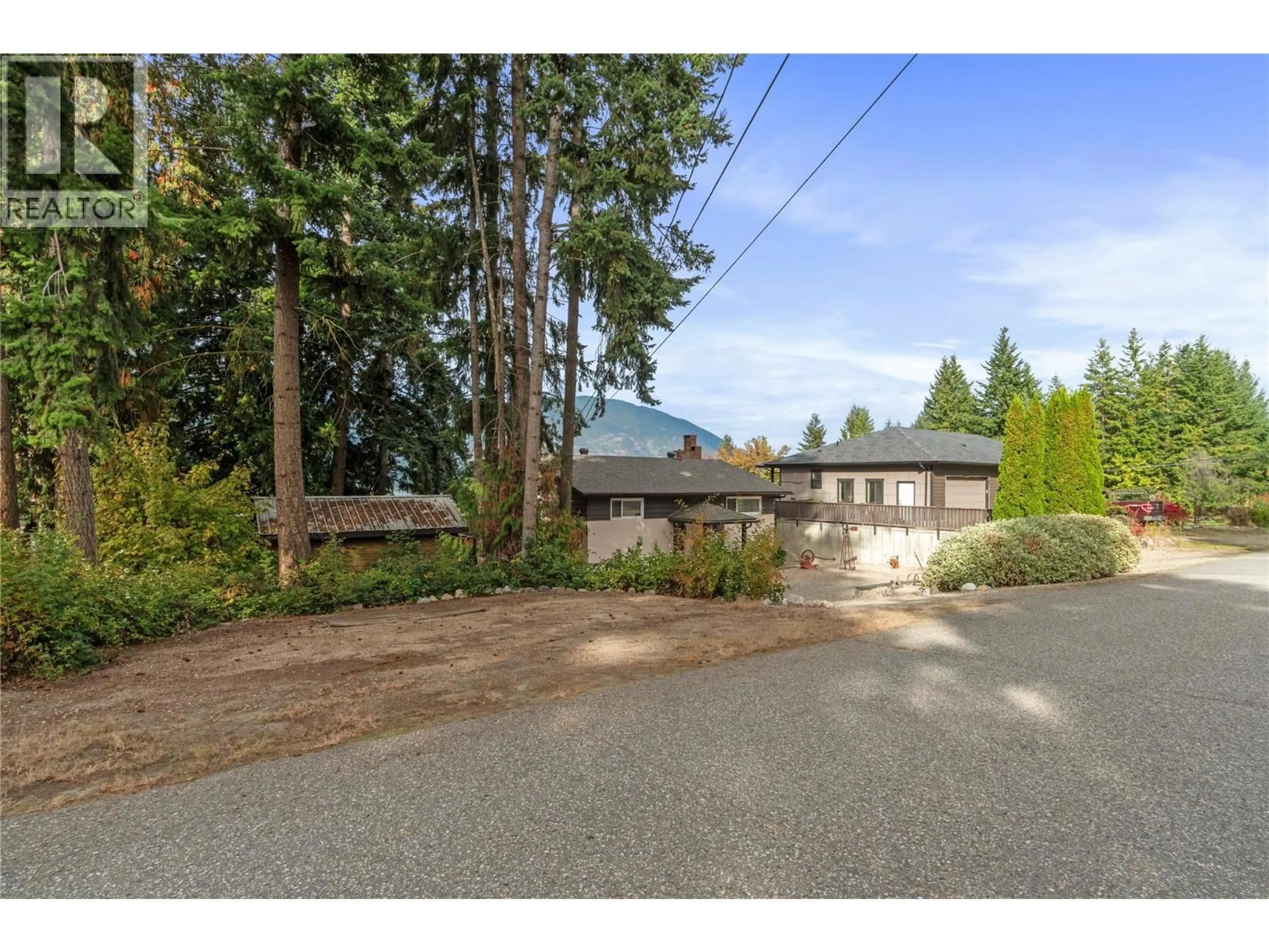 A pic from outside/outdoor area/front of a property/back of a property/a pic from drone, street for 1961 17 STREET NORTHEAST, Salmon Arm British Columbia V1E3Z4