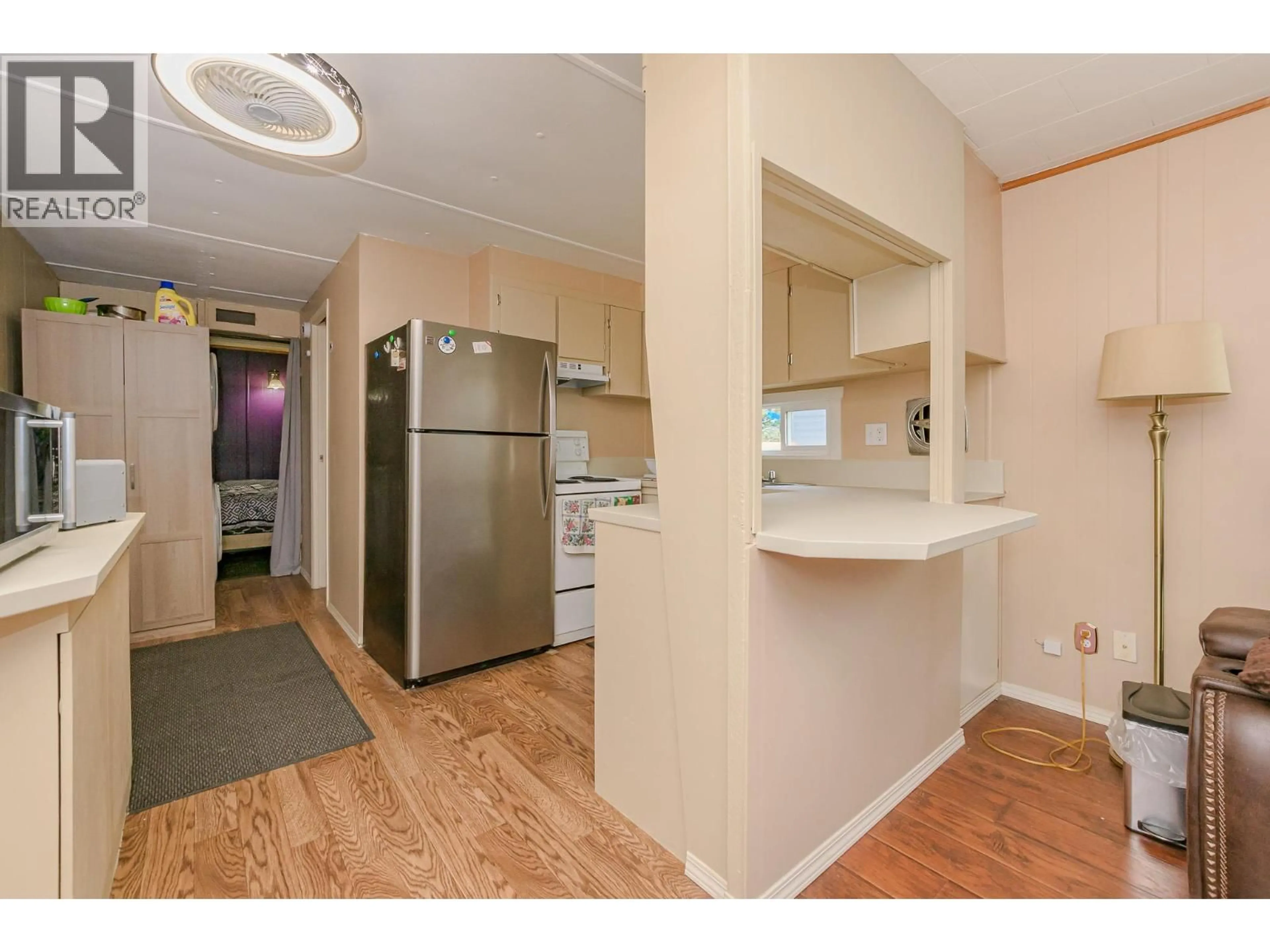 Standard kitchen, wood/laminate floor for 1 ROBSON ROAD, Mara British Columbia V0E2K0