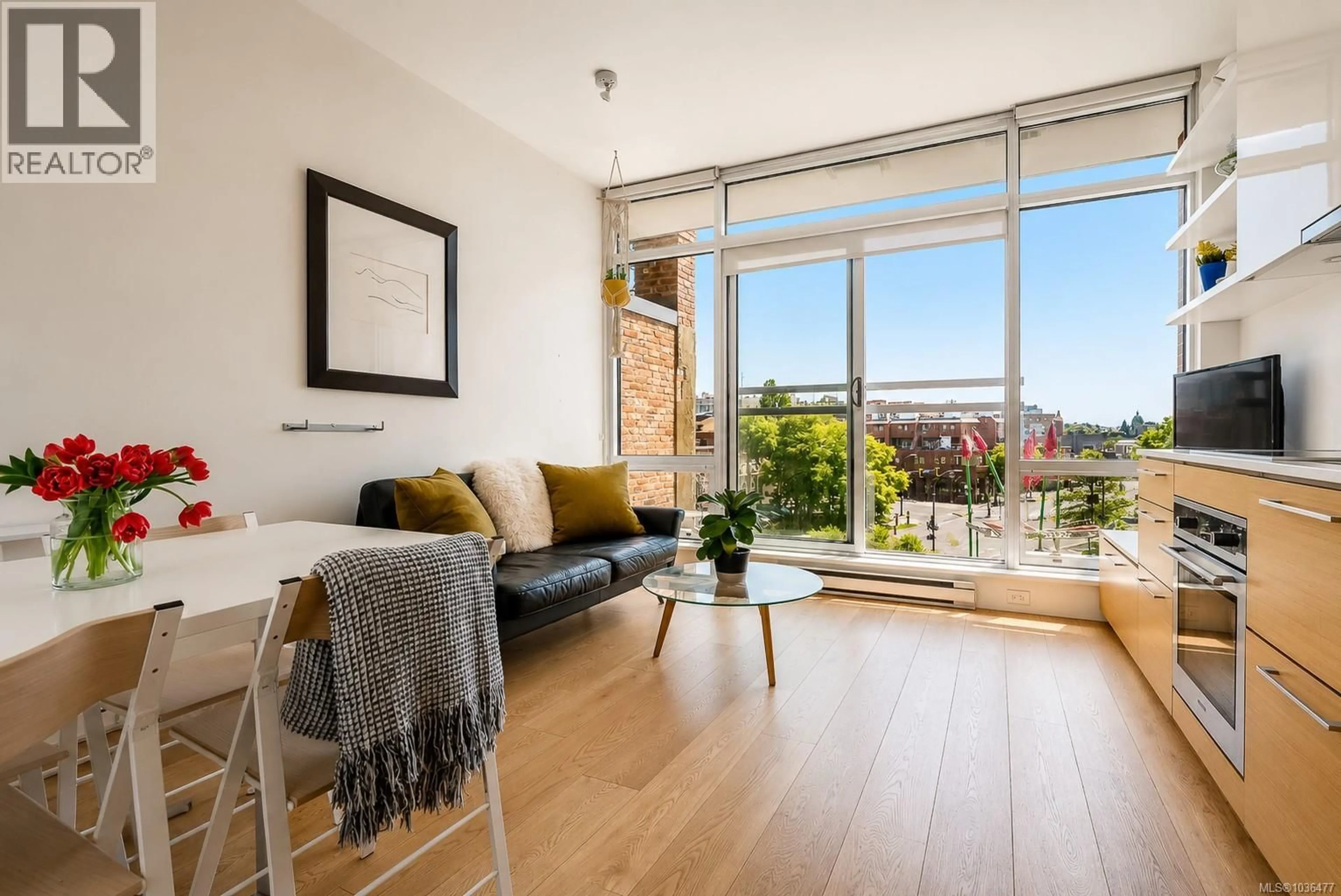 Living room with furniture, wood/laminate floor for 400 - 456 PANDORA AVENUE, Victoria British Columbia V8W0E3