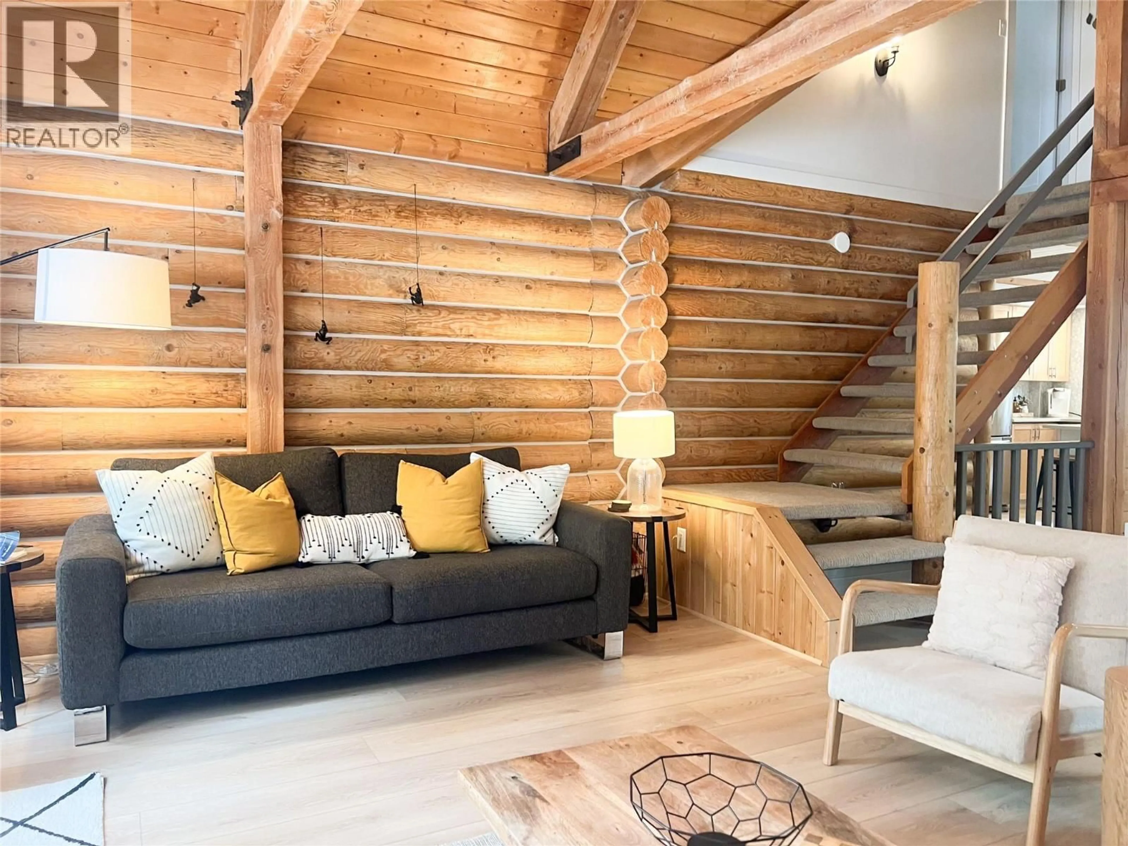 Living room with furniture, wood/laminate floor for 2094 PANORAMA DRIVE, Panorama British Columbia V0A1T0