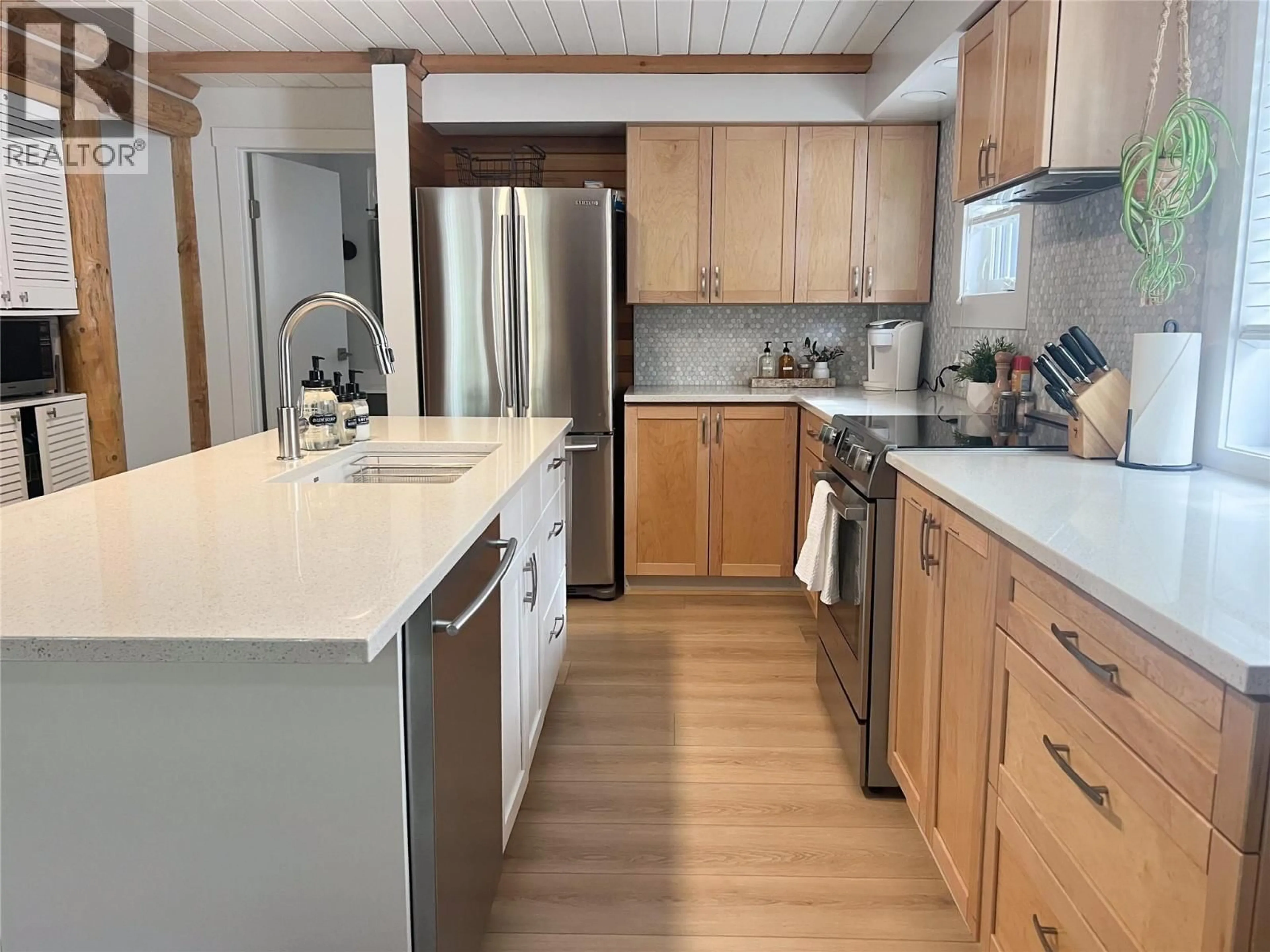 Open concept kitchen, wood/laminate floor for 2094 PANORAMA DRIVE, Panorama British Columbia V0A1T0