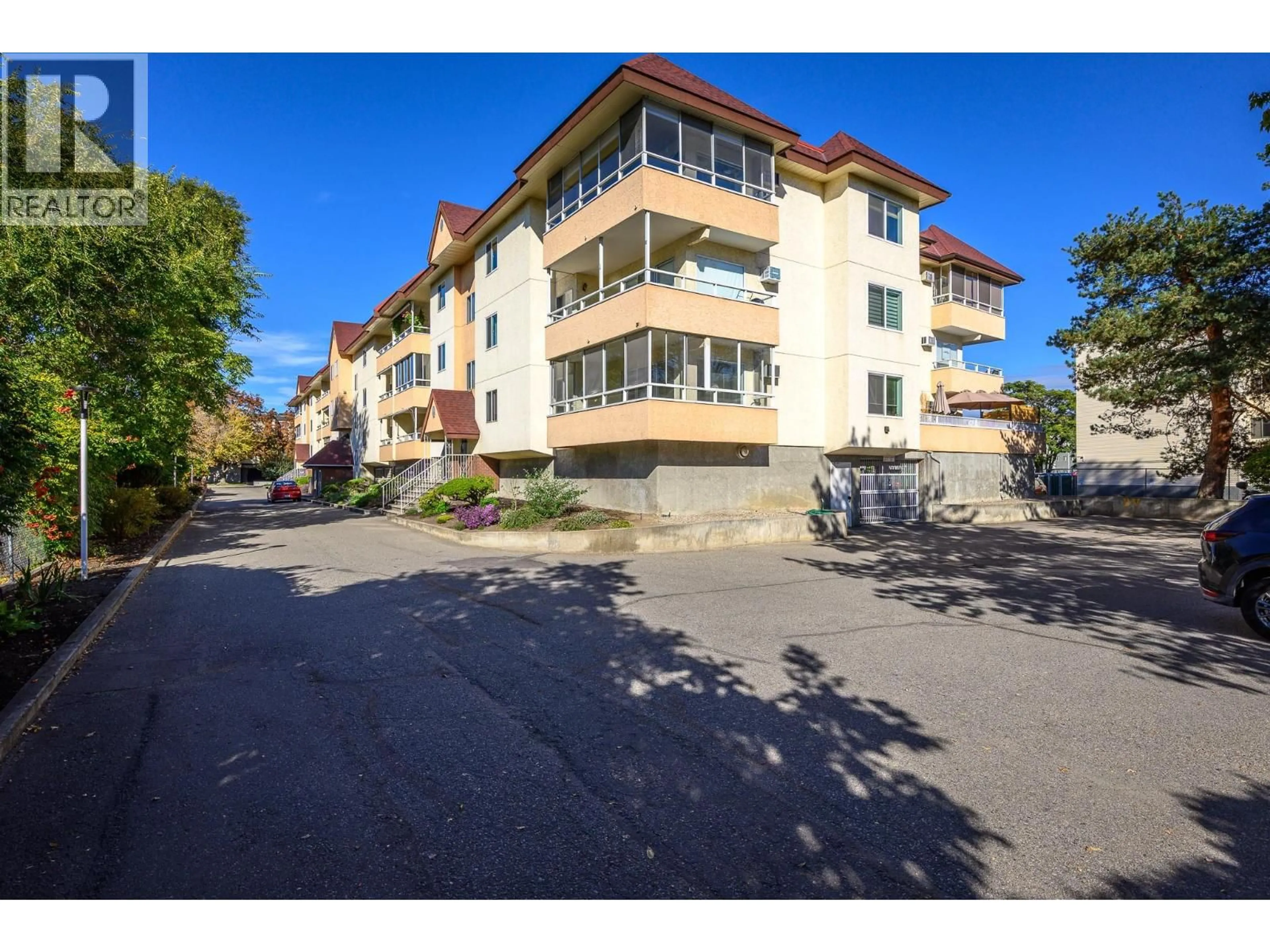 A pic from outside/outdoor area/front of a property/back of a property/a pic from drone, street for 311 - 1249 PACIFIC AVENUE, Kelowna British Columbia V1Y5T9