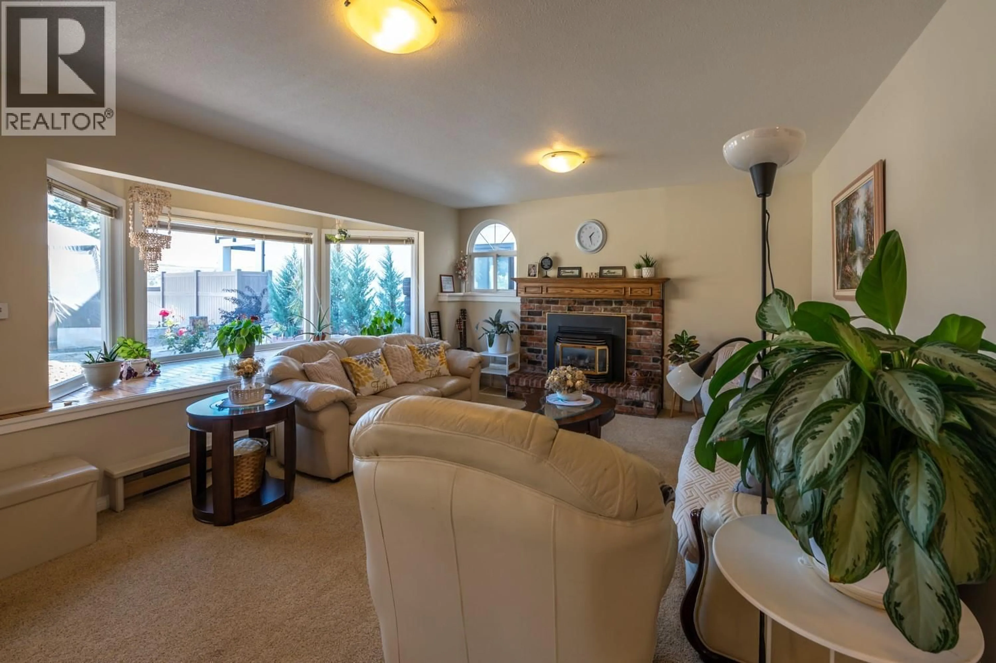 Living room with furniture, ceramic/tile floor for 6764 LAKESIDE DRIVE, Oliver British Columbia V0H1T4