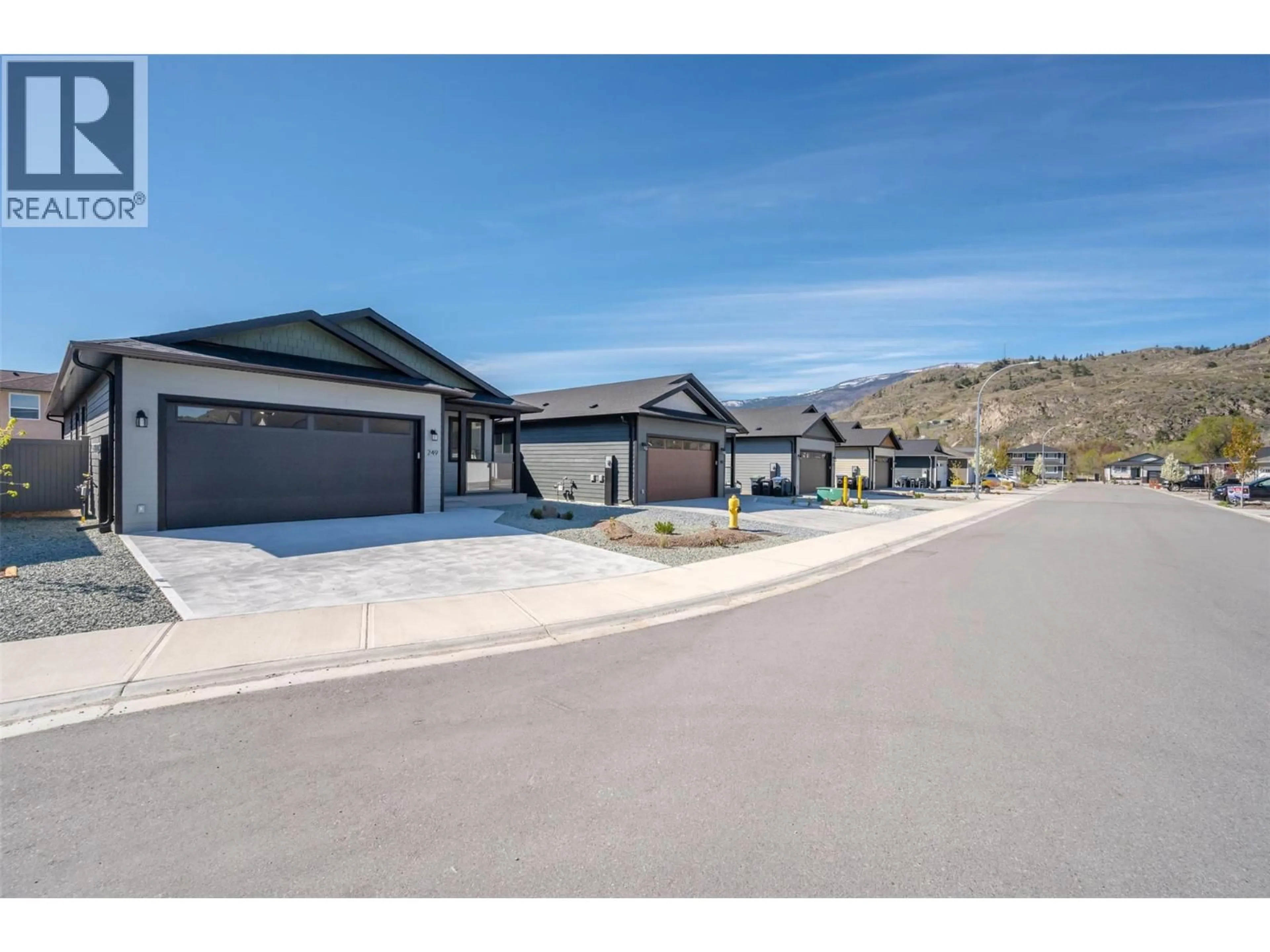 A pic from outside/outdoor area/front of a property/back of a property/a pic from drone, street for 249 BENTGRASS AVENUE, Oliver British Columbia V0H1T3