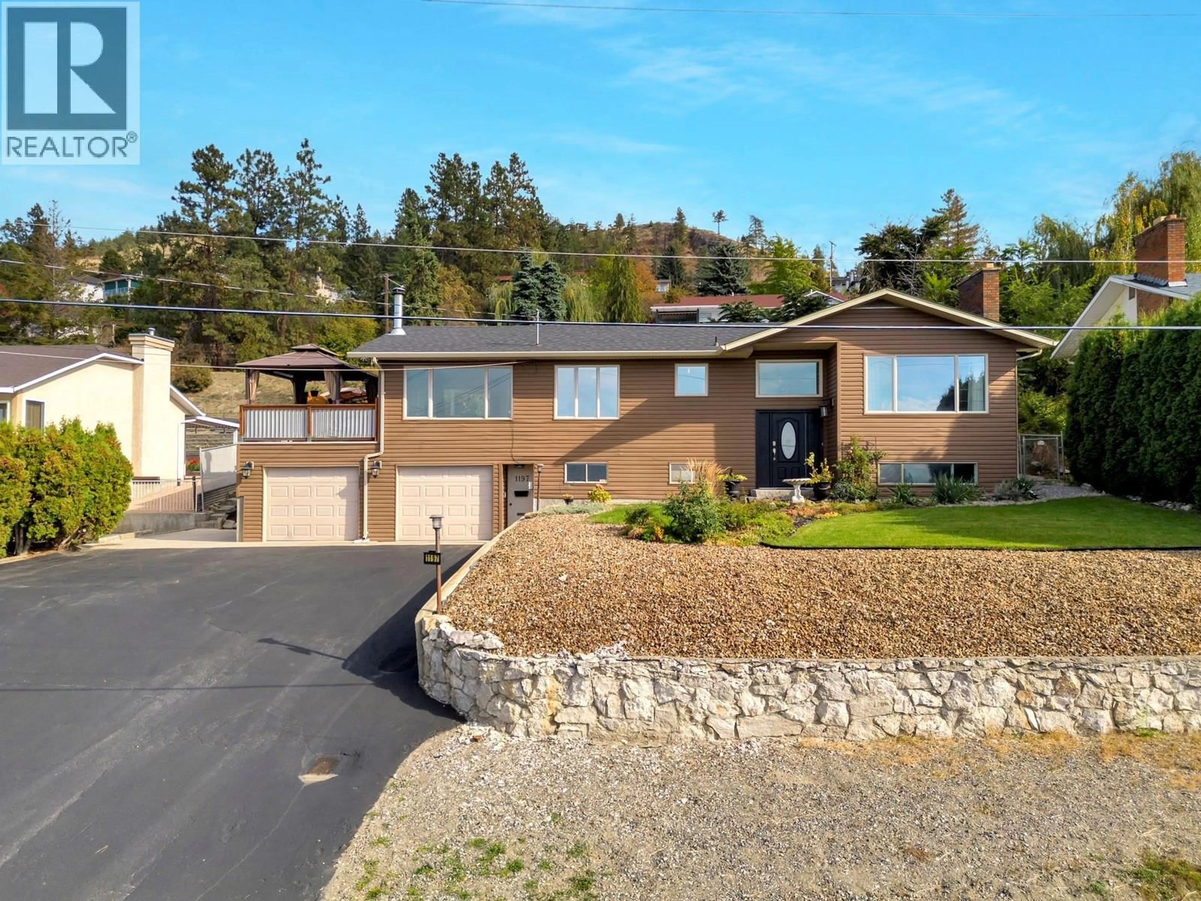 Home with vinyl exterior material, street for 1197 BENTIEN ROAD, Kelowna British Columbia V1P1C7
