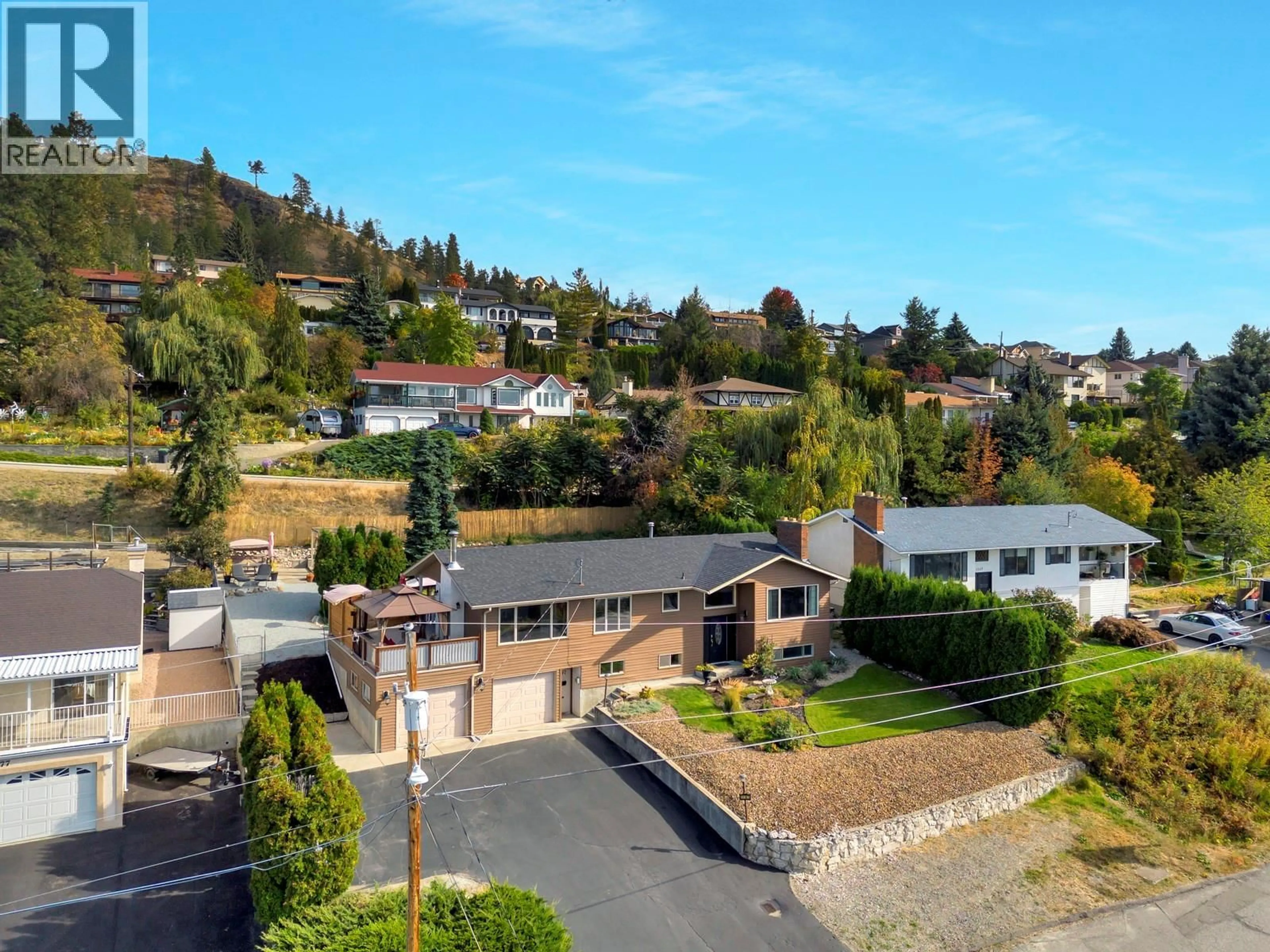 A pic from outside/outdoor area/front of a property/back of a property/a pic from drone, street for 1197 BENTIEN ROAD, Kelowna British Columbia V1P1C7