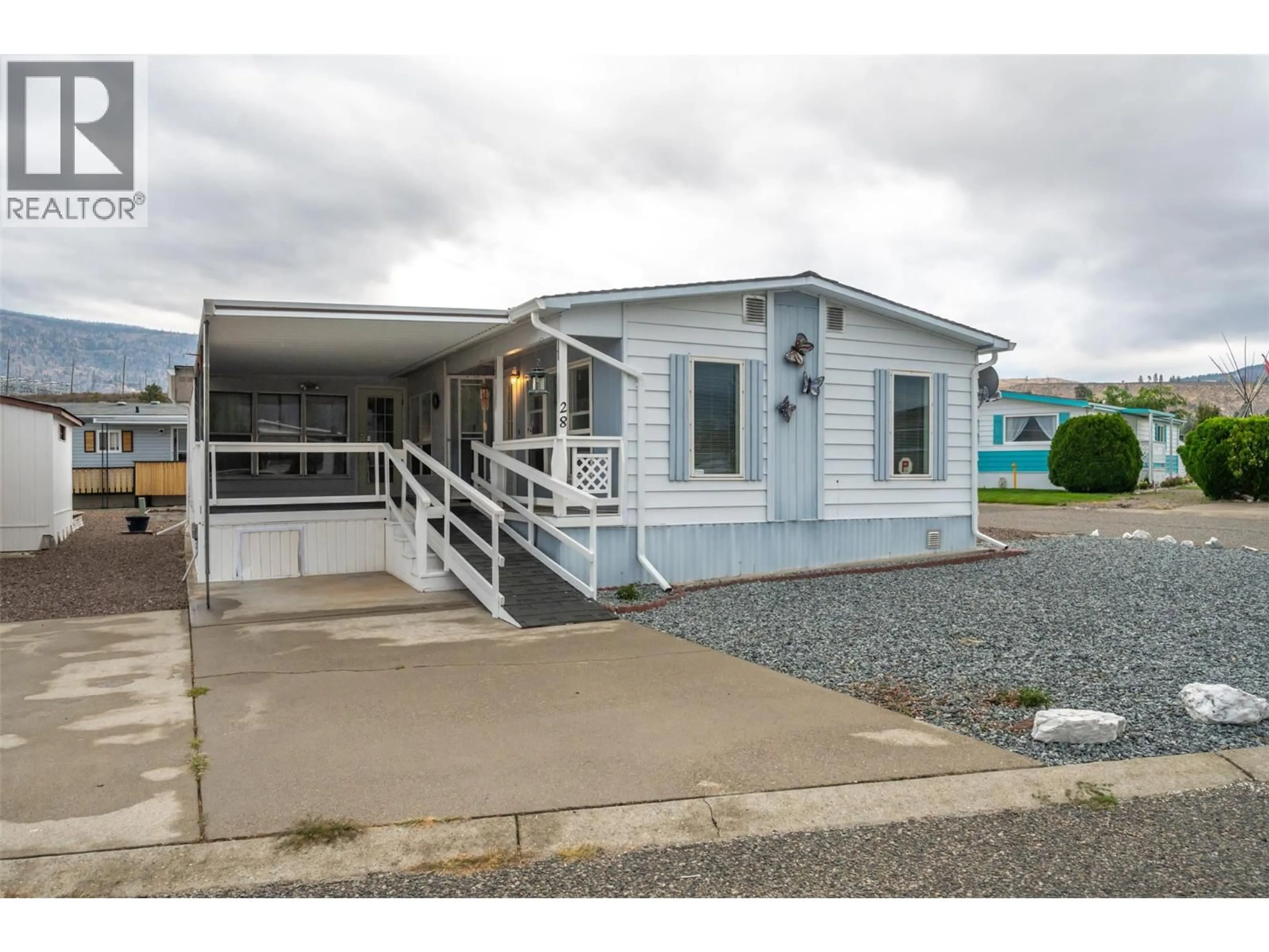 Home with vinyl exterior material, street for 28 - 6601 TUCELNUIT DRIVE, Oliver British Columbia V0H1T3