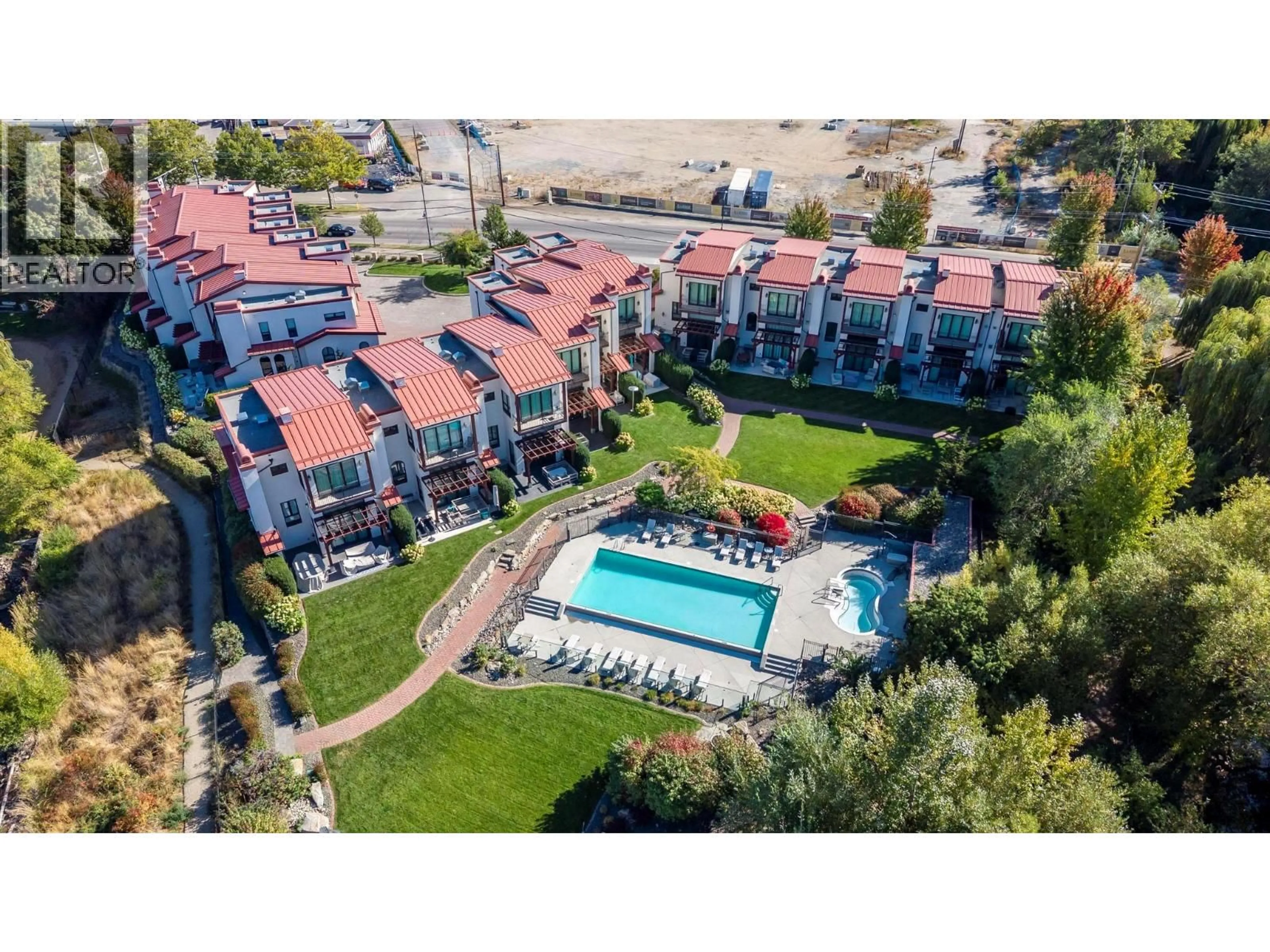 A pic from outside/outdoor area/front of a property/back of a property/a pic from drone, mountain view for 13 - 3756 LAKESHORE ROAD, Kelowna British Columbia V1W3L4