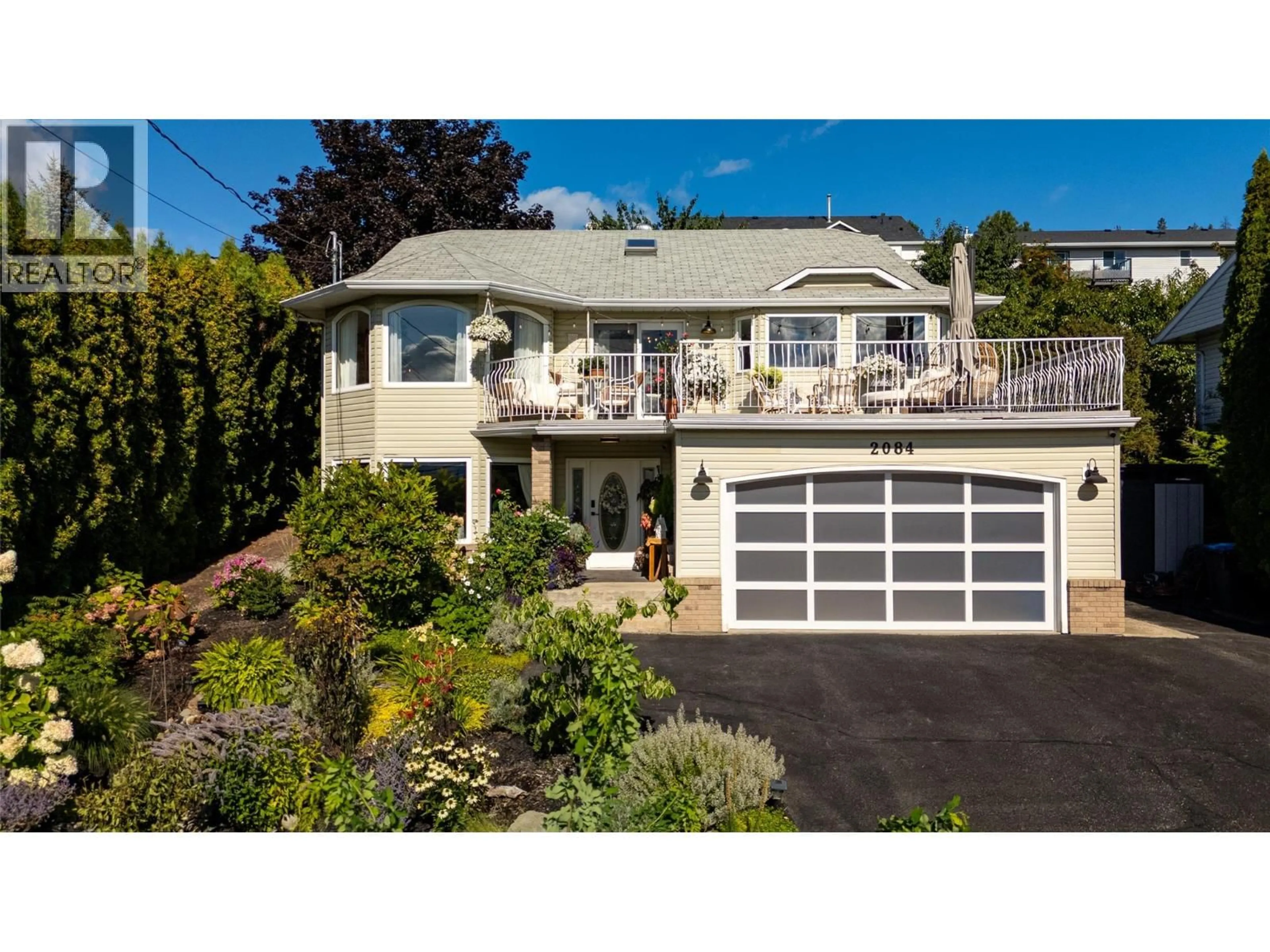 Home with vinyl exterior material, street for 2084 SHAMROCK DRIVE, West Kelowna British Columbia V4T1T8