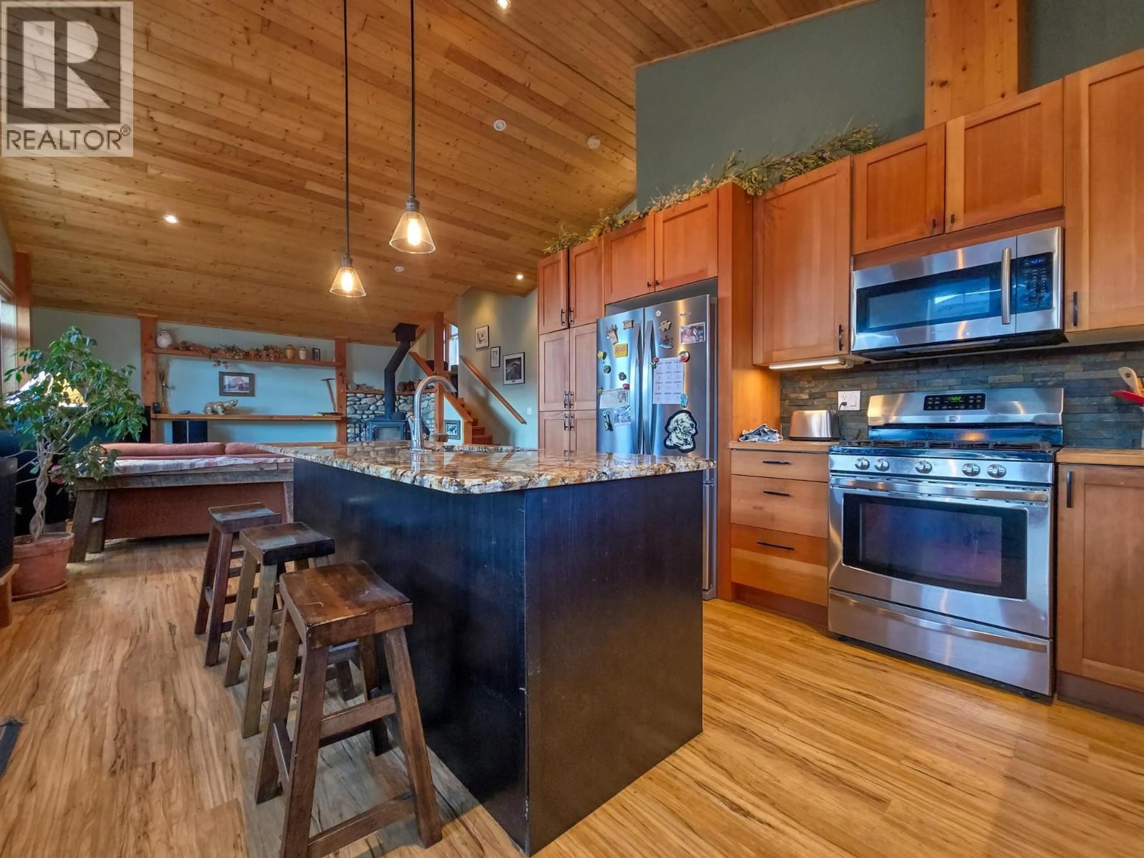 Open concept kitchen, wood/laminate floor for 918 5TH AVENUE, Invermere British Columbia V0A1K0