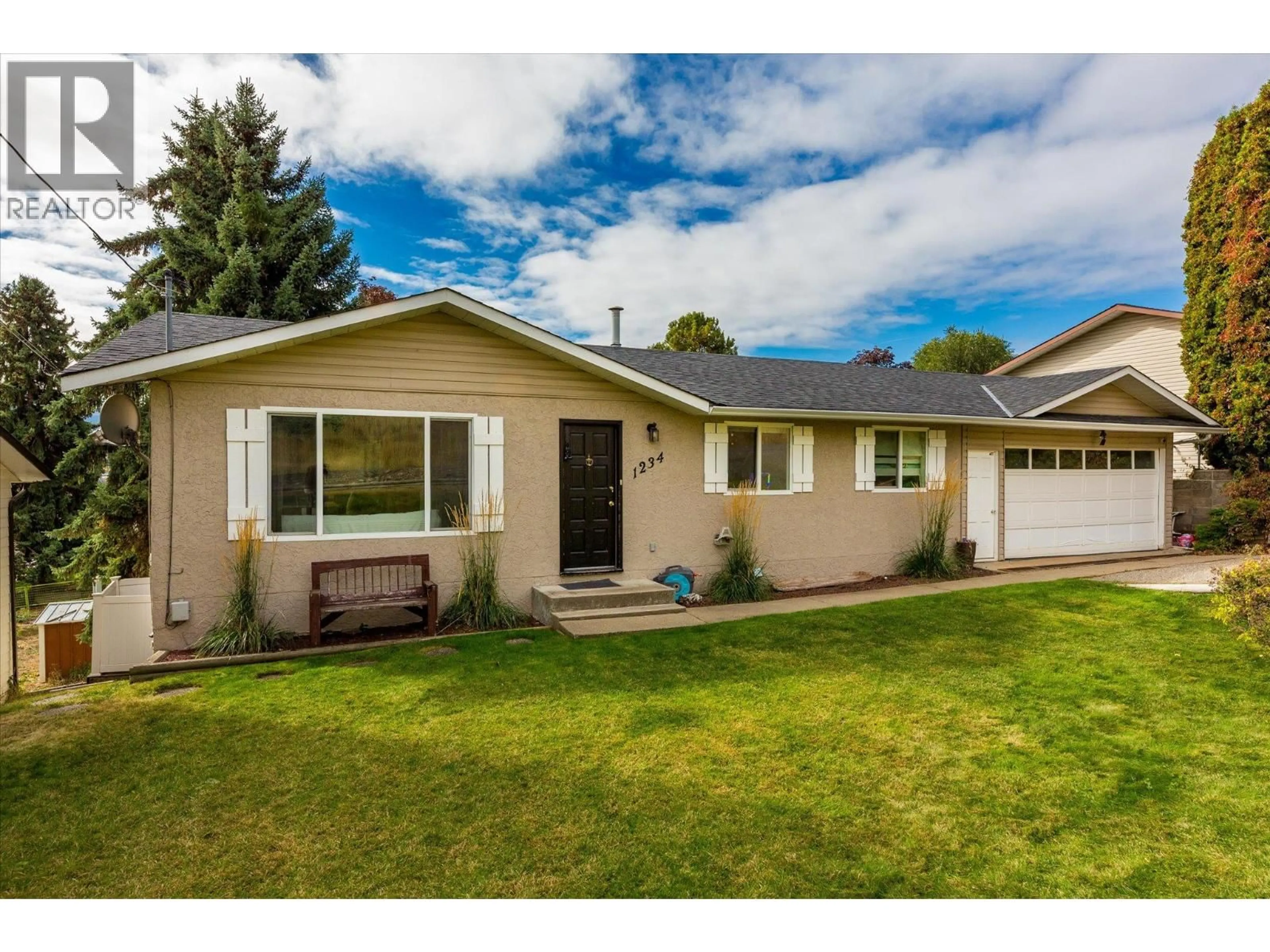 Home with vinyl exterior material, street for 1234 OSWELL DRIVE, Kelowna British Columbia V1P1L6