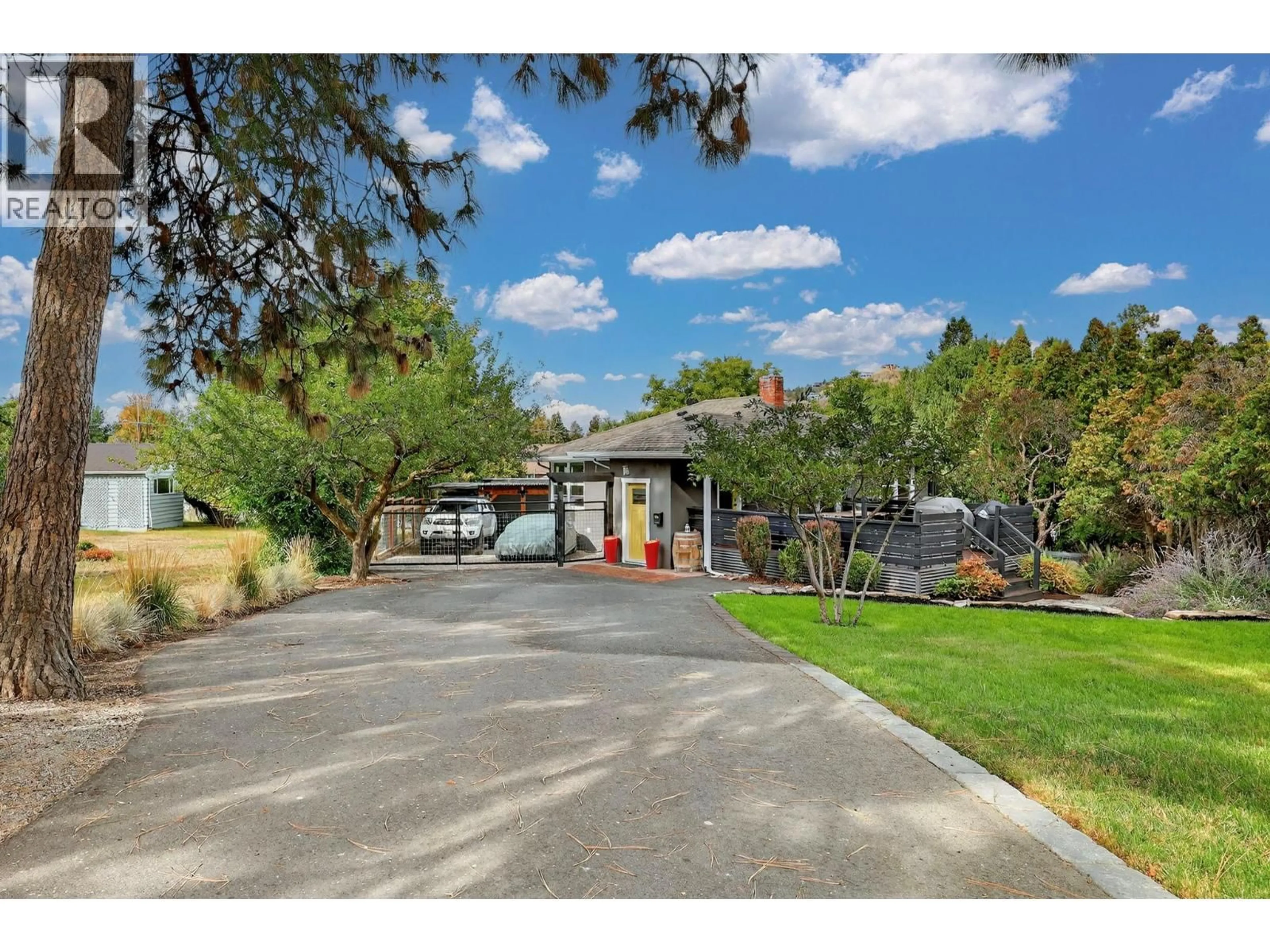 A pic from outside/outdoor area/front of a property/back of a property/a pic from drone, street for 1230 RIDGEWAY DRIVE, Kelowna British Columbia V1Y4M1