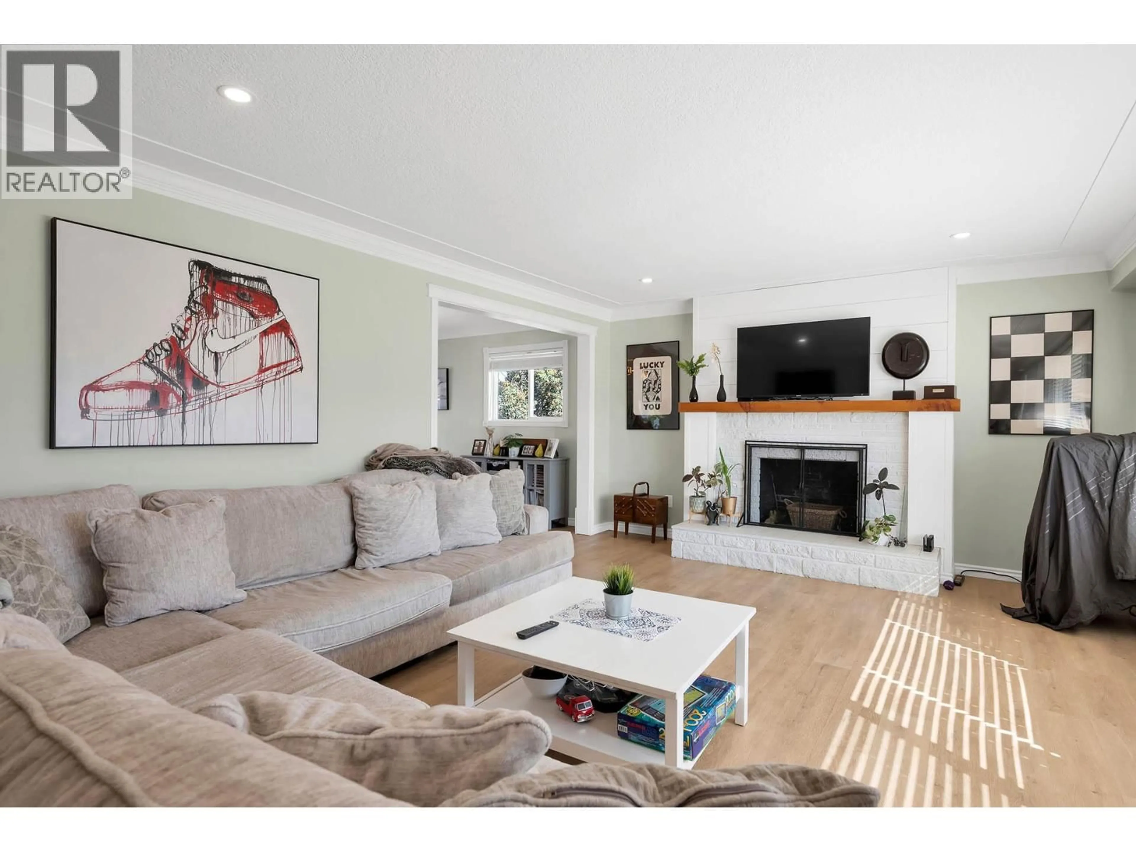 Living room with furniture, wood/laminate floor for 2436 YOUNG AVENUE, Kamloops British Columbia V2B4M8