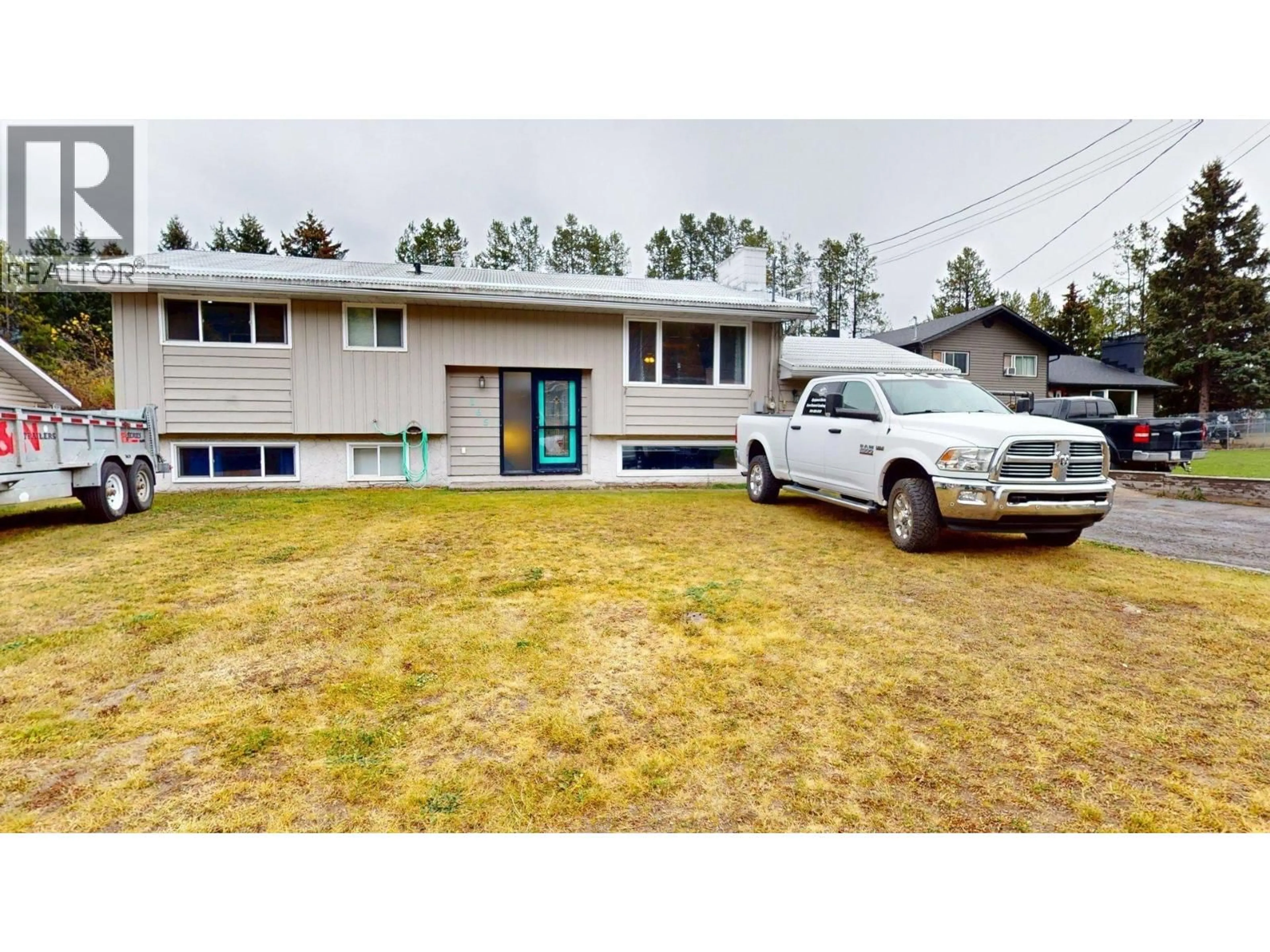 Home with vinyl exterior material, street for 165 CODY CRESCENT, Elkford British Columbia V0B1H0
