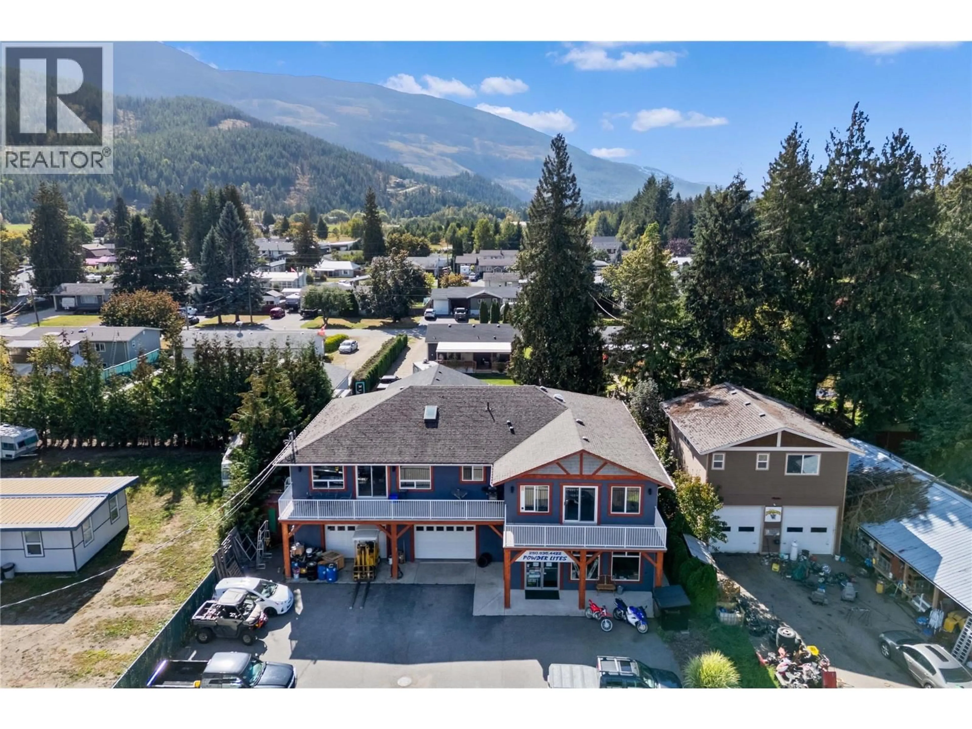 A pic from outside/outdoor area/front of a property/back of a property/a pic from drone, mountain view for 725 TRANS CANADA HIGHWAY, Sicamous British Columbia V0E2V0