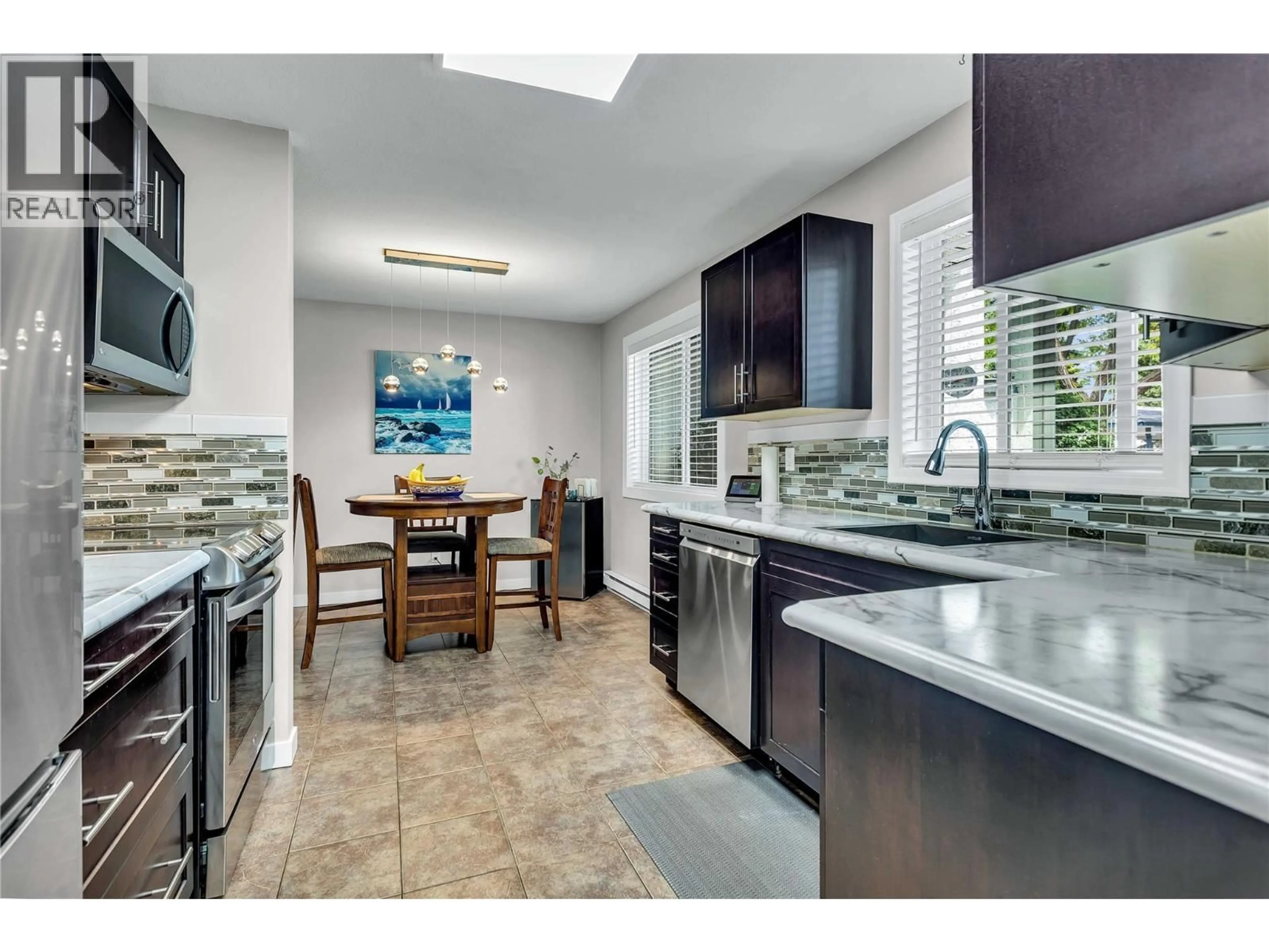 Open concept kitchen, ceramic/tile floor for 104 - 1480 TERAI ROAD, Kelowna British Columbia V1X7H3