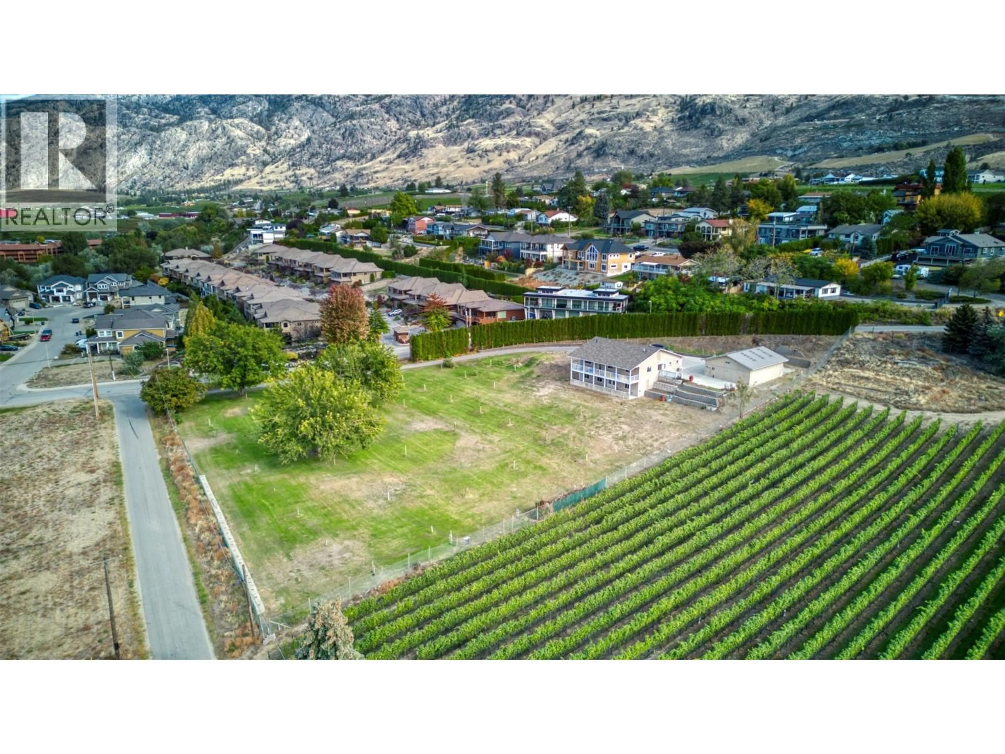 A pic from outside/outdoor area/front of a property/back of a property/a pic from drone, mountain view for 3251 41ST STREET, Osoyoos British Columbia V0H1V6