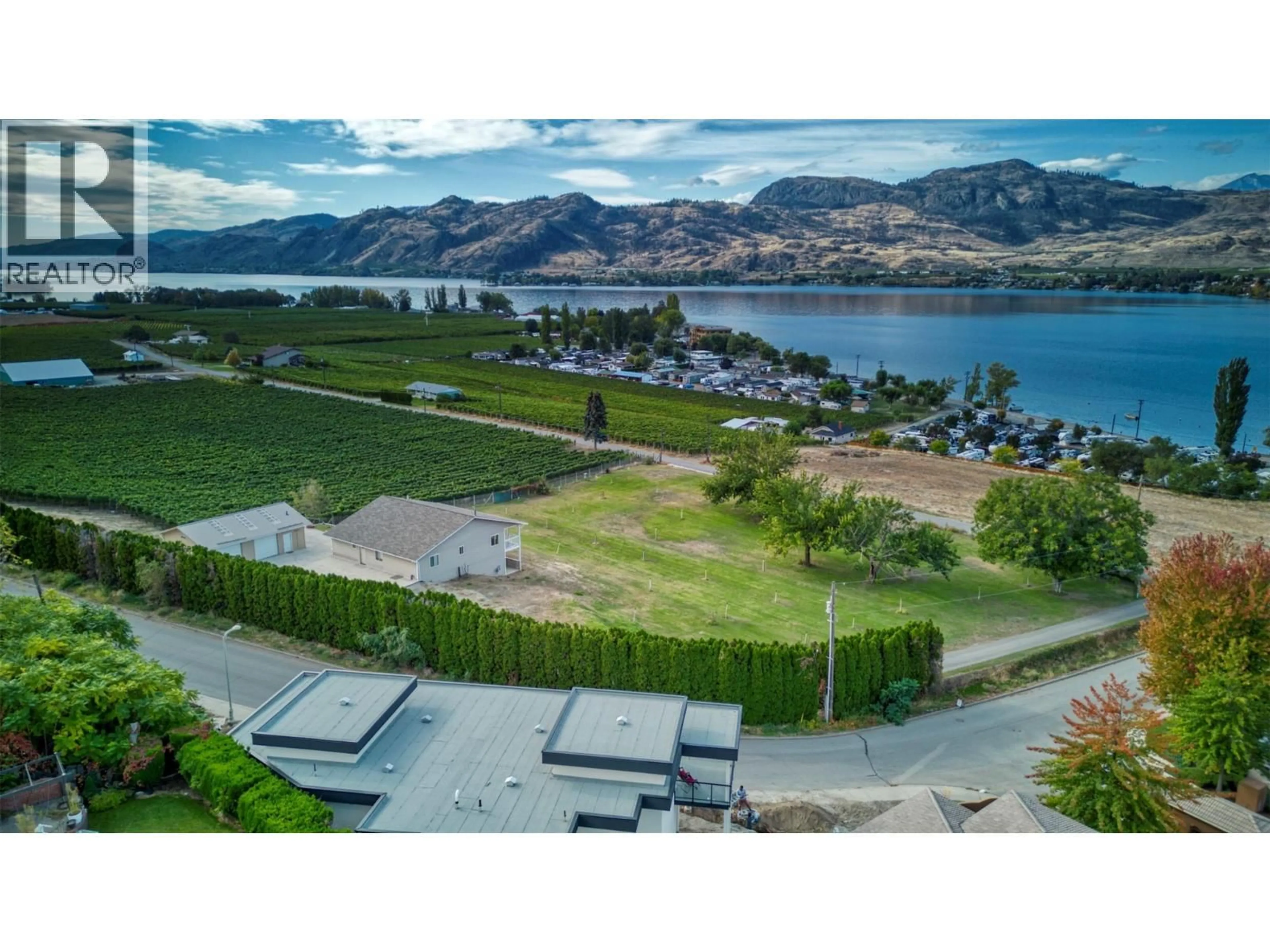A pic from outside/outdoor area/front of a property/back of a property/a pic from drone, water/lake/river/ocean view for 3251 41ST STREET, Osoyoos British Columbia V0H1V6