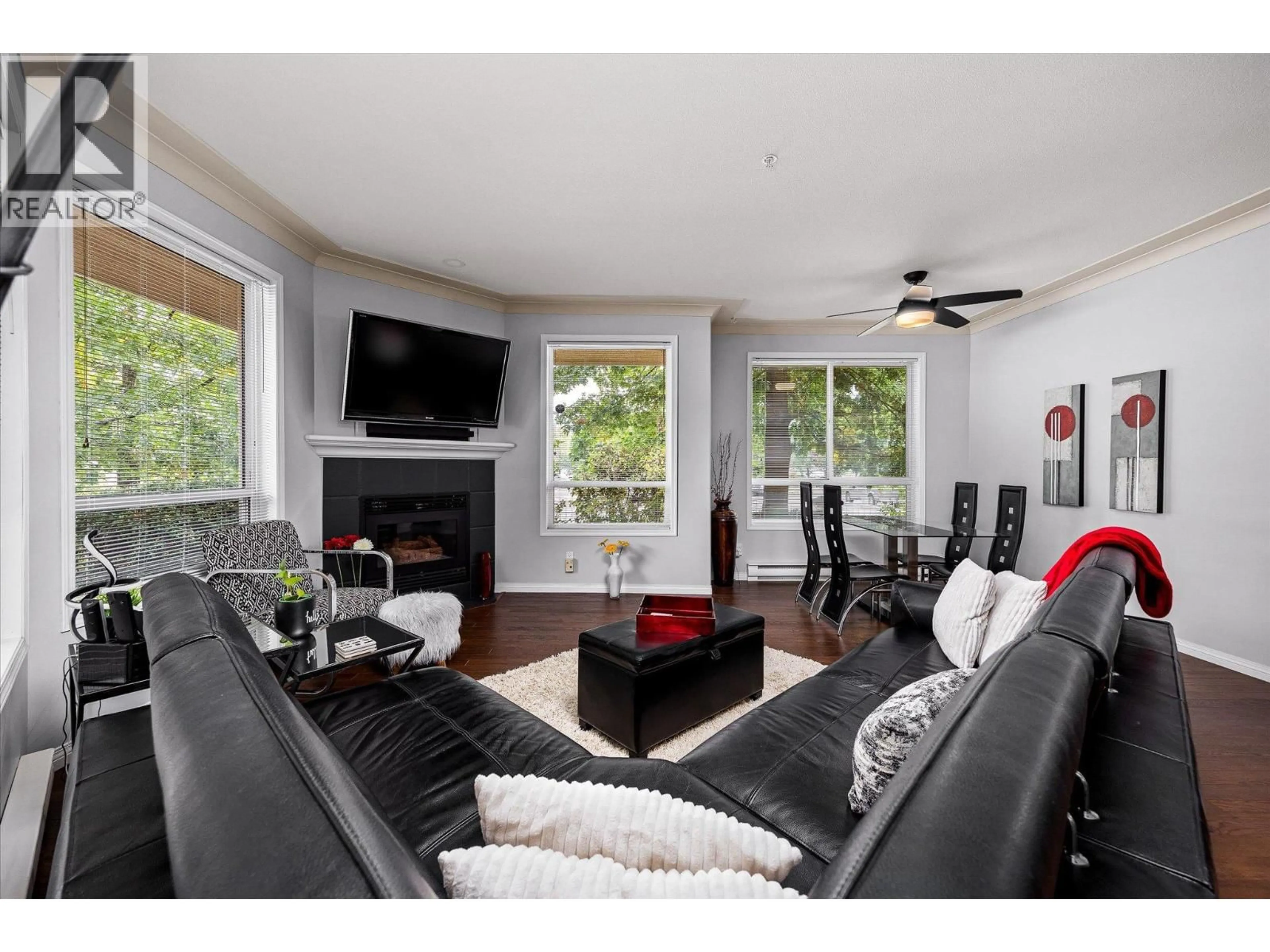 Living room with furniture, wood/laminate floor for 115 - 1964 ENTERPRISE WAY, Kelowna British Columbia V1Y9S7