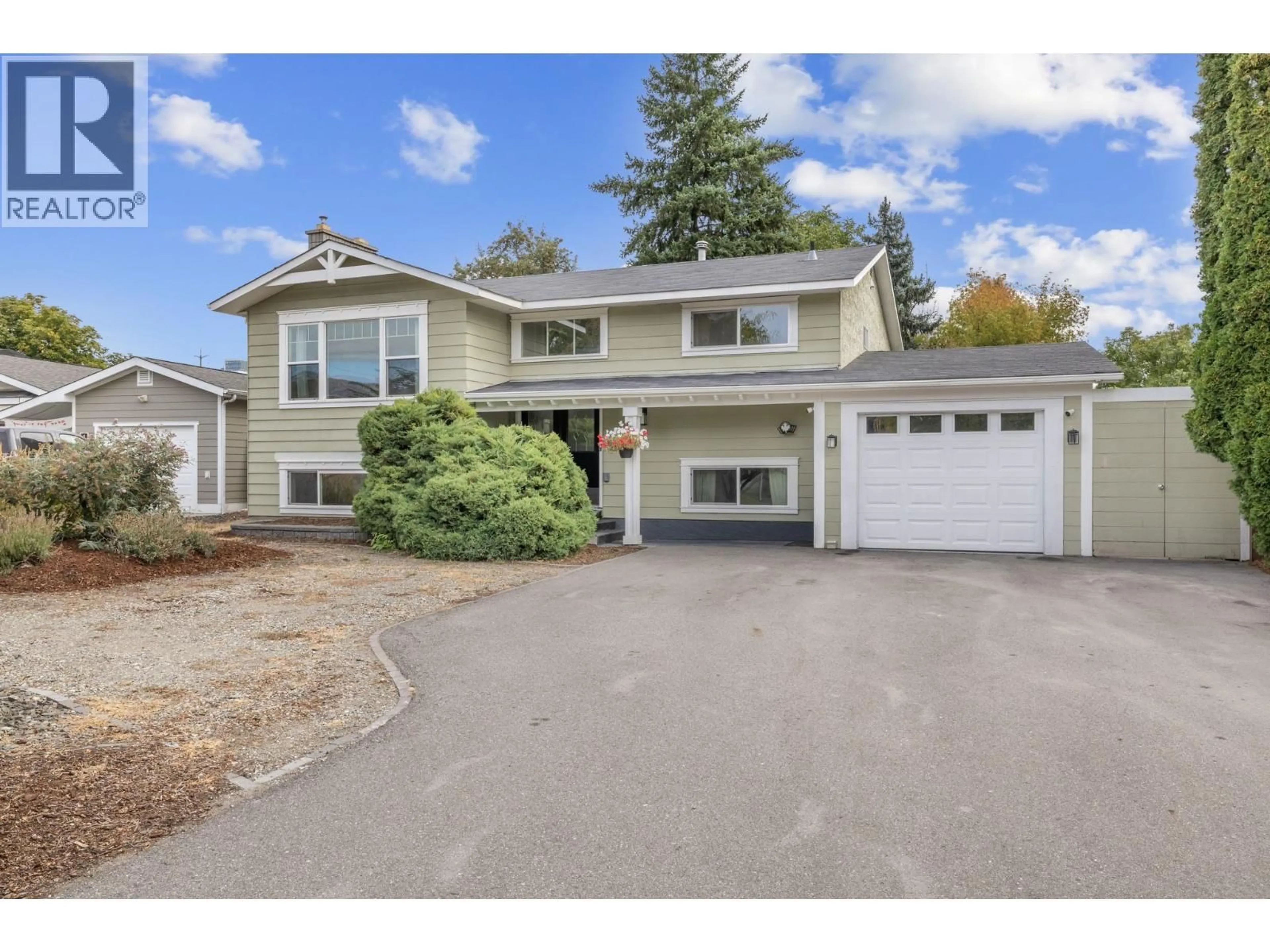 Home with vinyl exterior material, street for 1342 MCBRIDE ROAD, Kelowna British Columbia V1Y4A6