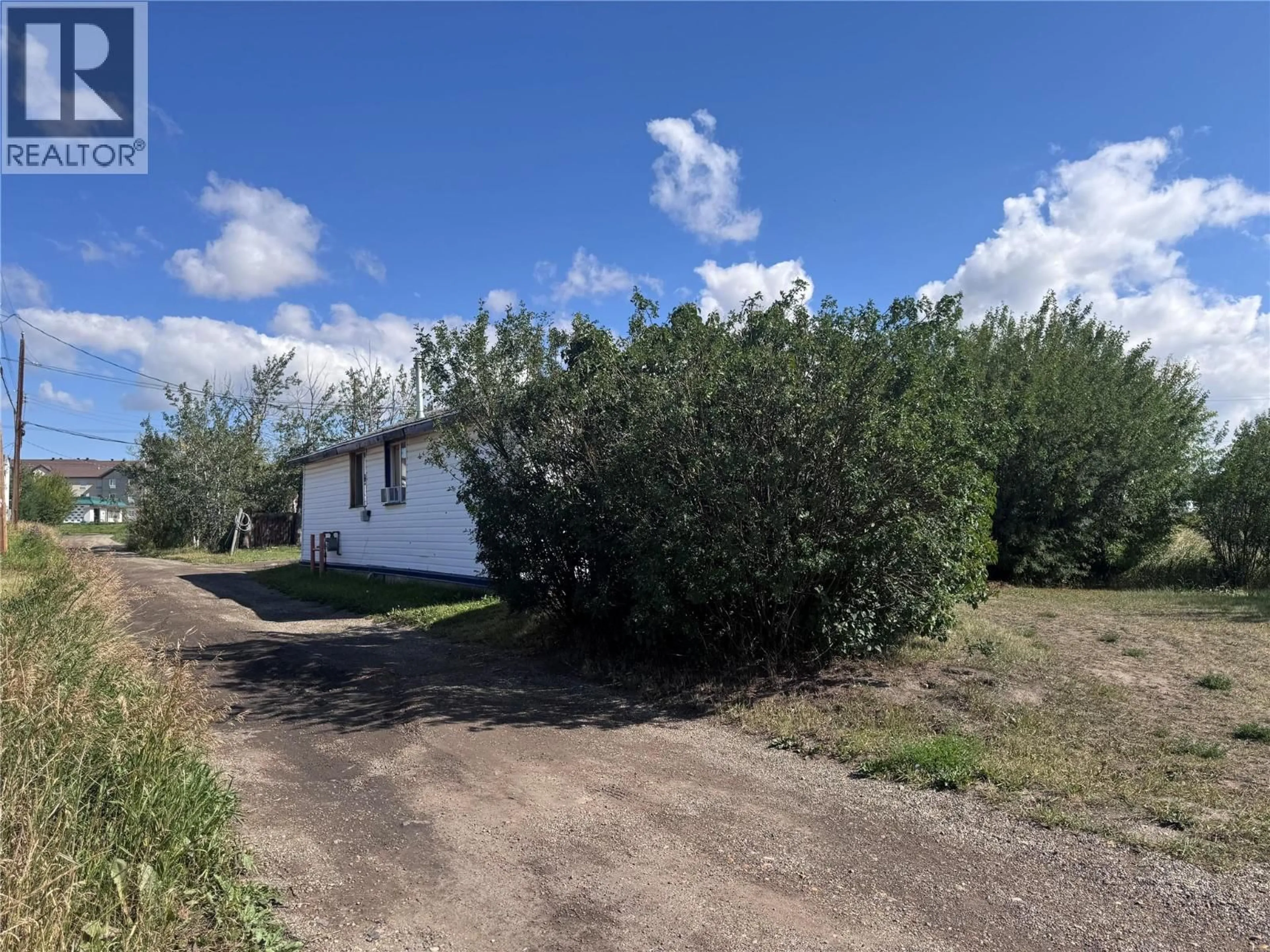 A pic from outside/outdoor area/front of a property/back of a property/a pic from drone, street for 1330 101 AVENUE, Dawson Creek British Columbia V1G1V8