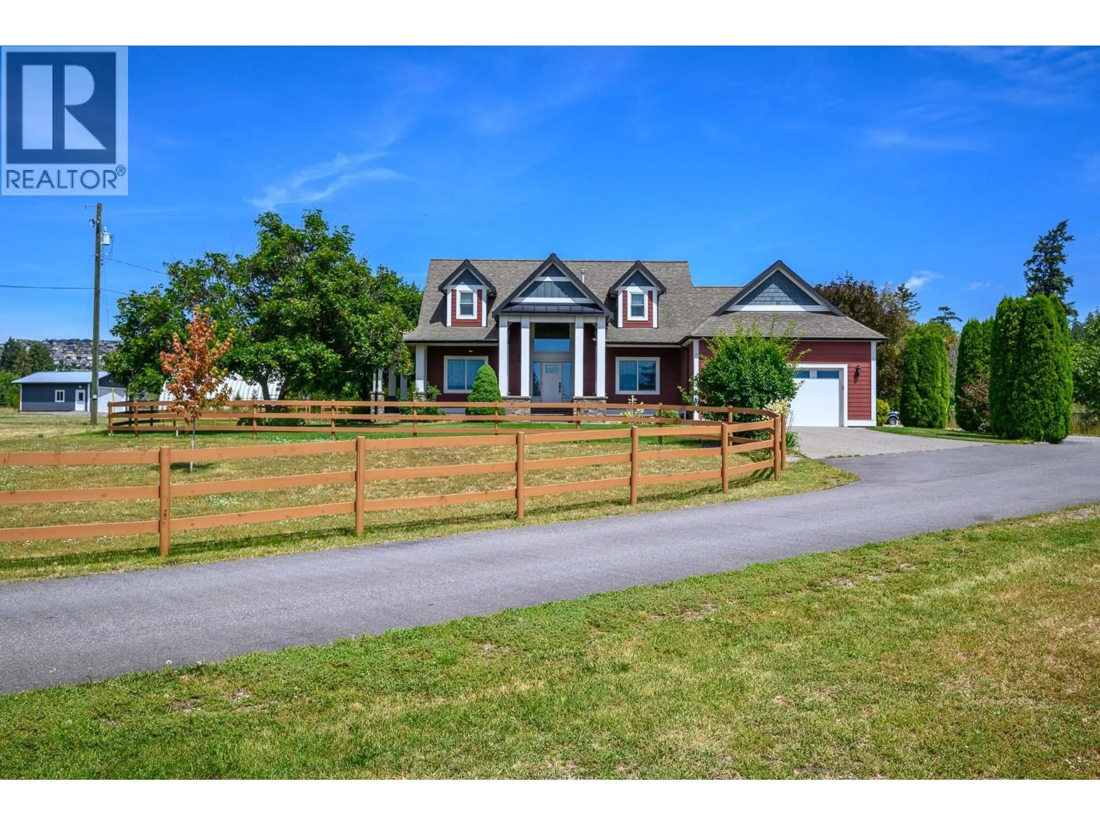 A pic from outside/outdoor area/front of a property/back of a property/a pic from drone, street for 5795 EAST VERNON ROAD, Vernon British Columbia V1B3K1