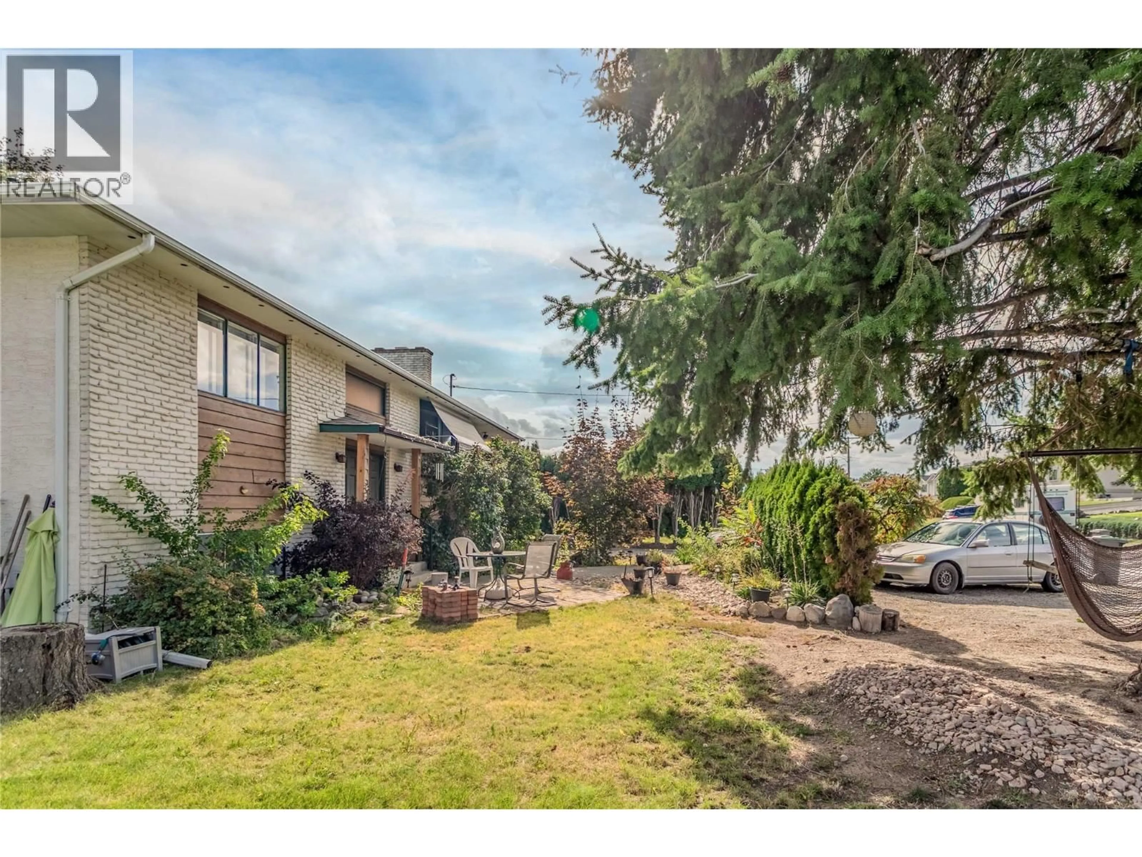 A pic from outside/outdoor area/front of a property/back of a property/a pic from drone, street for 1775 HAYASHI ROAD, Kelowna British Columbia V1P1A7