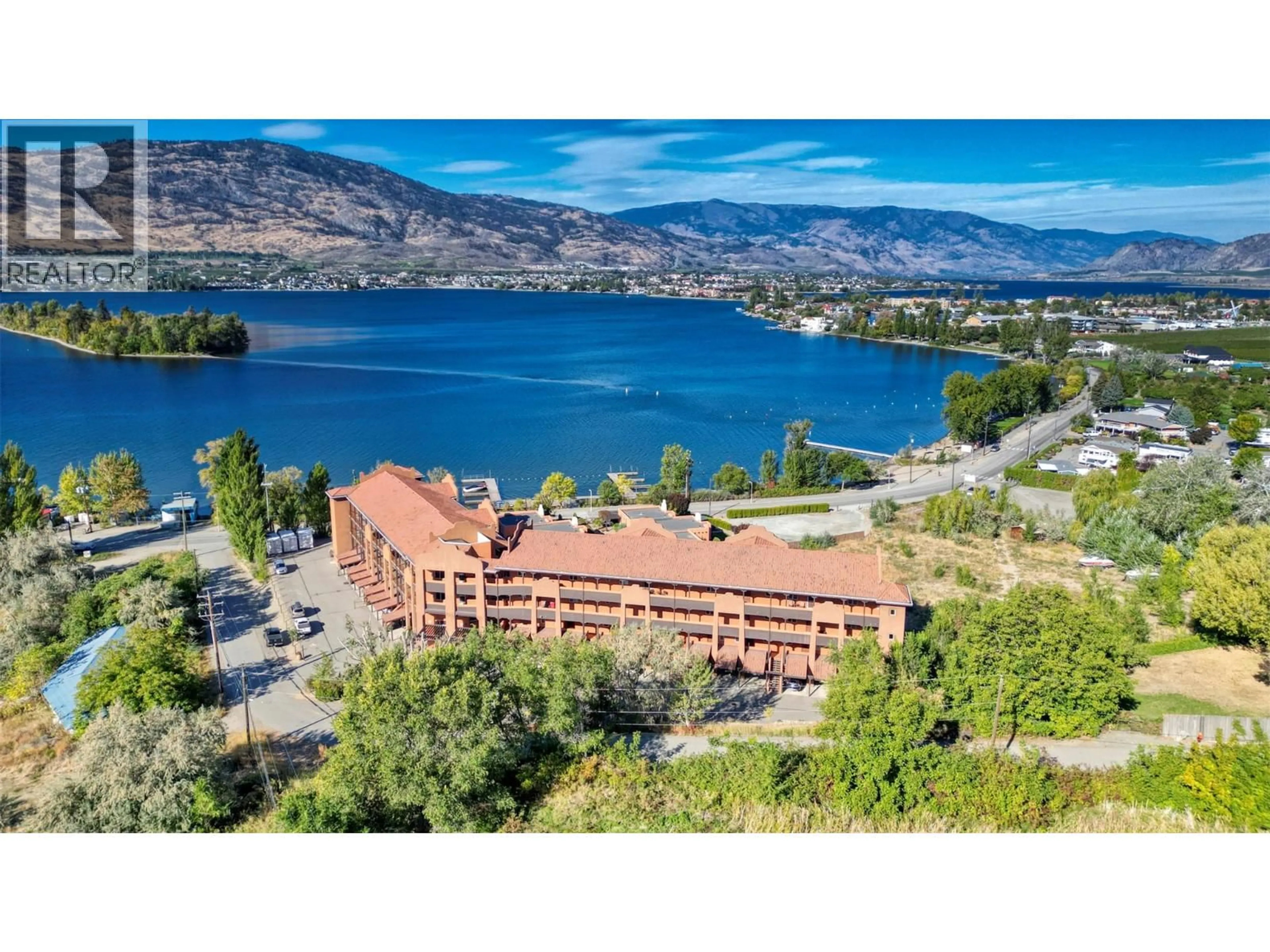A pic from outside/outdoor area/front of a property/back of a property/a pic from drone, water/lake/river/ocean view for 307 - 4300 44TH AVENUE, Osoyoos British Columbia V0H1V6
