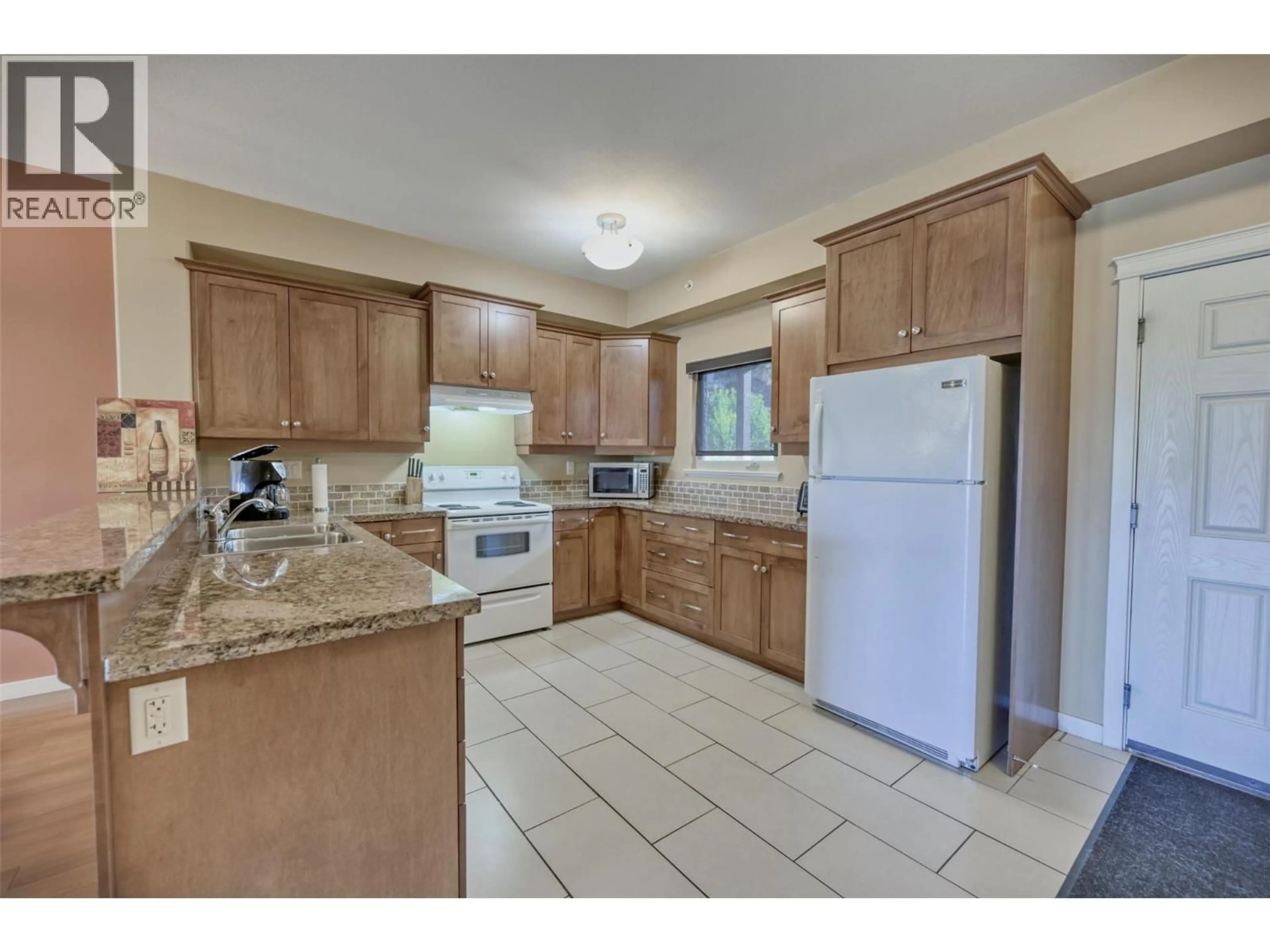Standard kitchen, ceramic/tile floor for 307 - 4300 44TH AVENUE, Osoyoos British Columbia V0H1V6