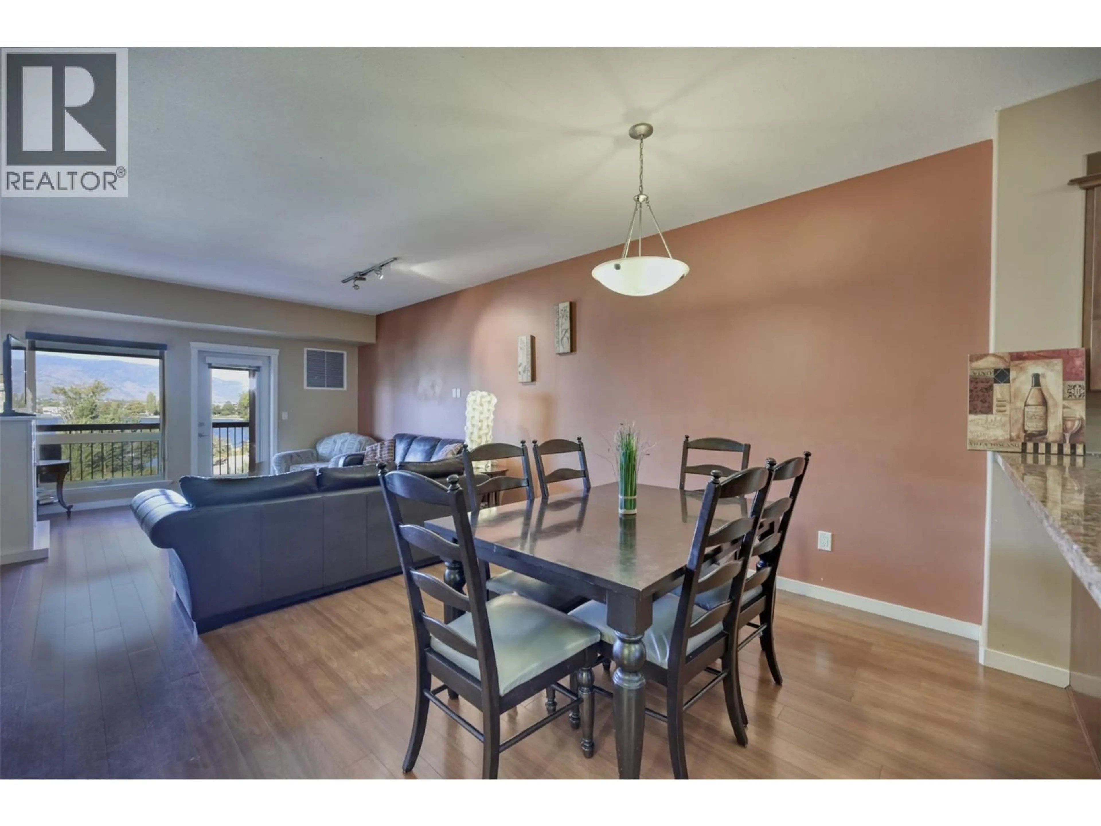 Dining room, wood/laminate floor for 307 - 4300 44TH AVENUE, Osoyoos British Columbia V0H1V6