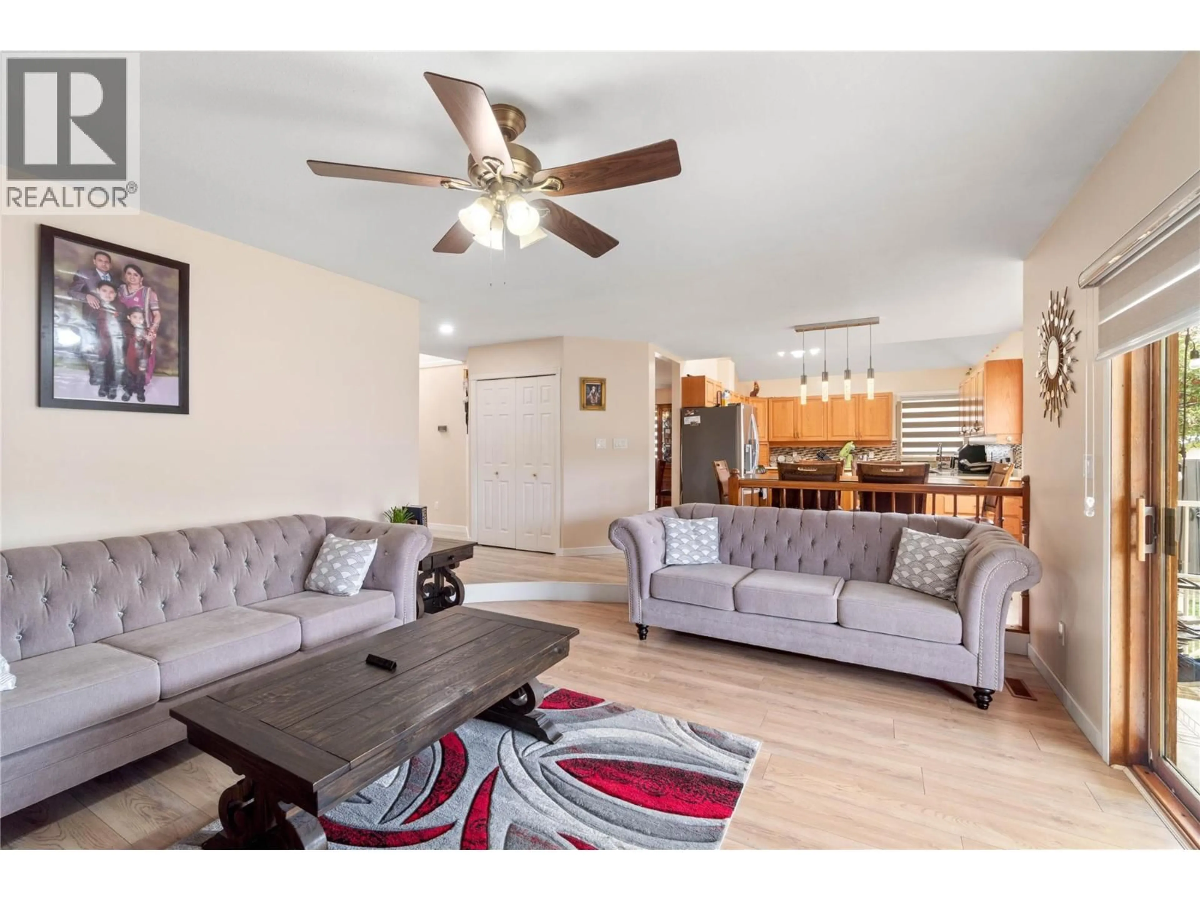 Living room with furniture, wood/laminate floor for 864 NICOLANI DRIVE, Kamloops British Columbia V2B5B3