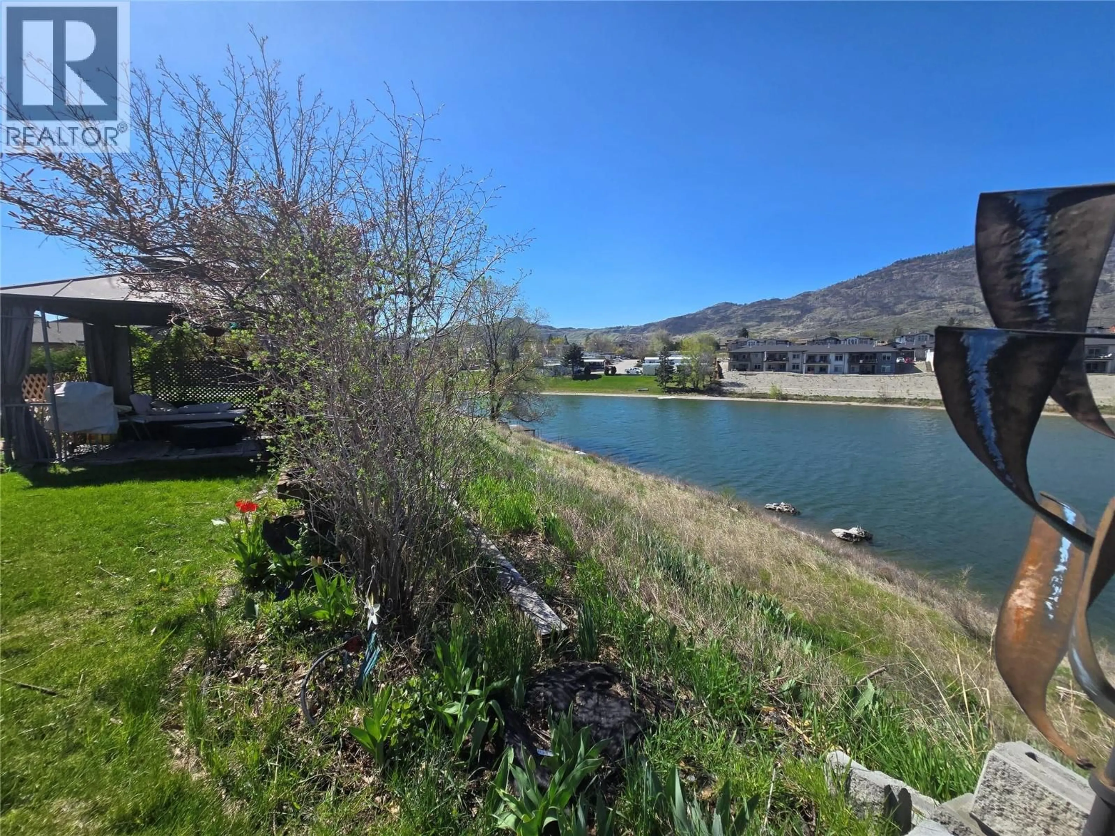A pic from outside/outdoor area/front of a property/back of a property/a pic from drone, water/lake/river/ocean view for 7816 89TH STREET, Osoyoos British Columbia V0h1V0