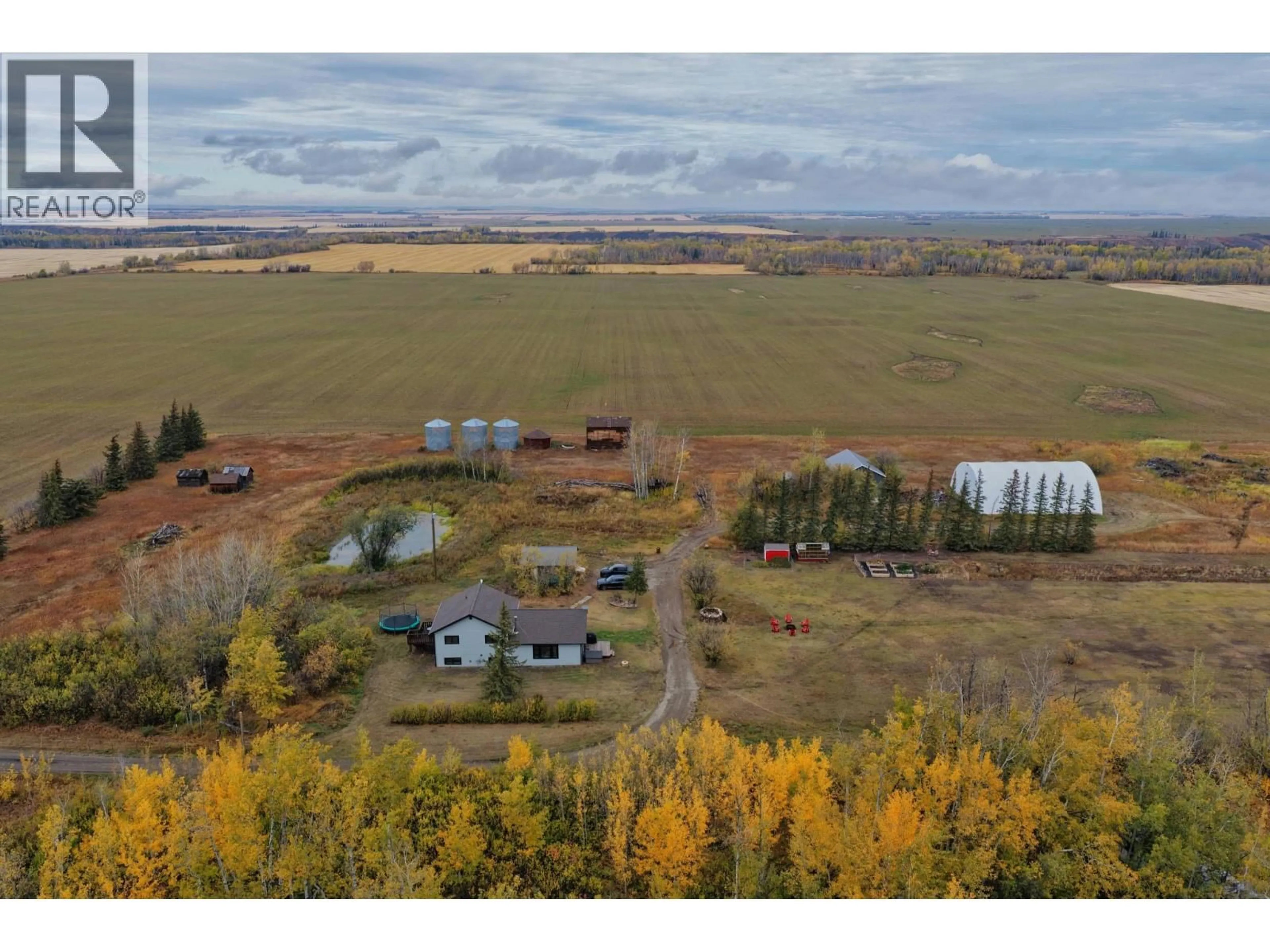 A pic from outside/outdoor area/front of a property/back of a property/a pic from drone, unknown for 279 LANDRY ROAD, Dawson Creek British Columbia V1G4E8