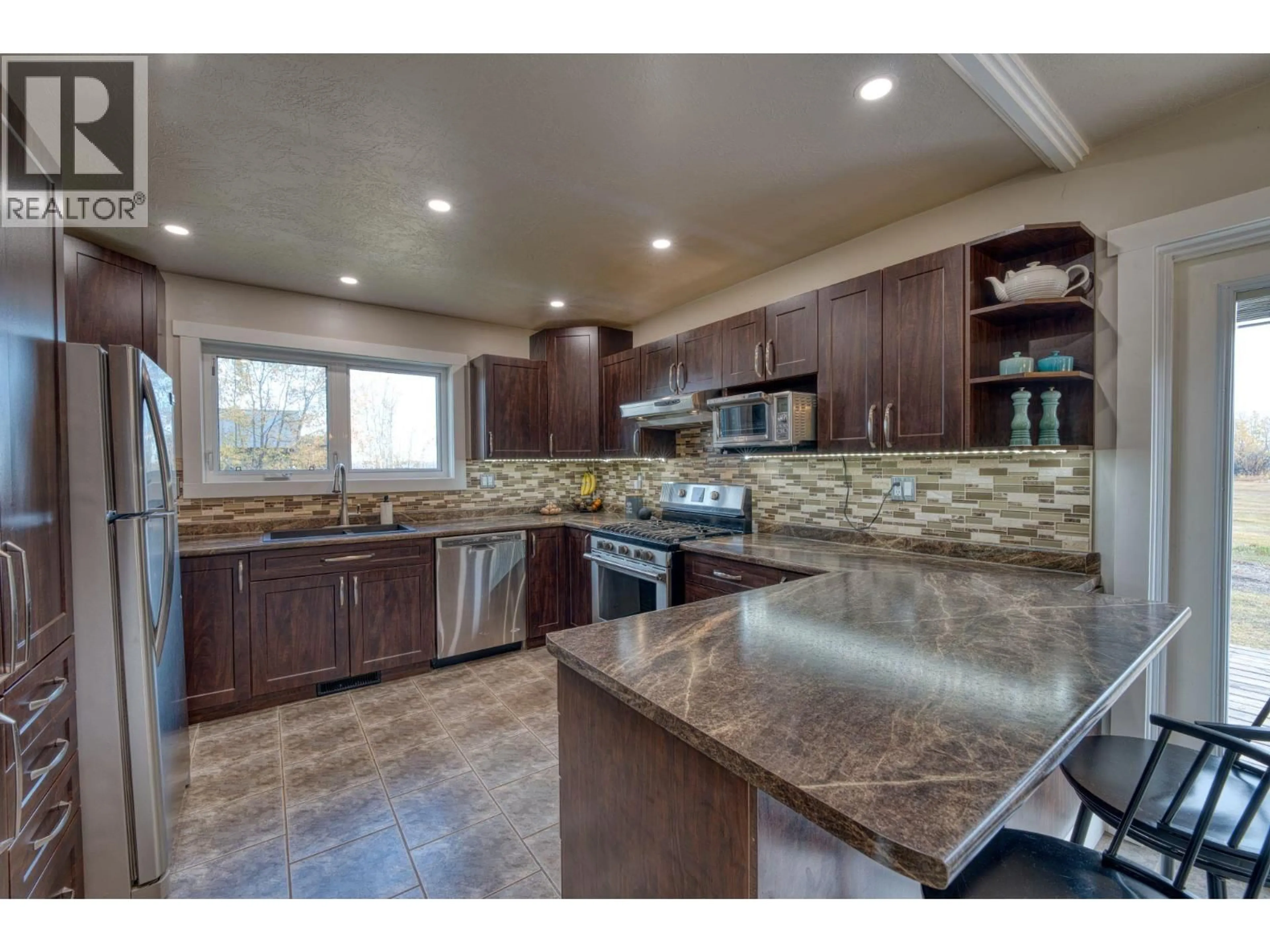 Open concept kitchen, ceramic/tile floor for 279 LANDRY ROAD, Dawson Creek British Columbia V1G4E8