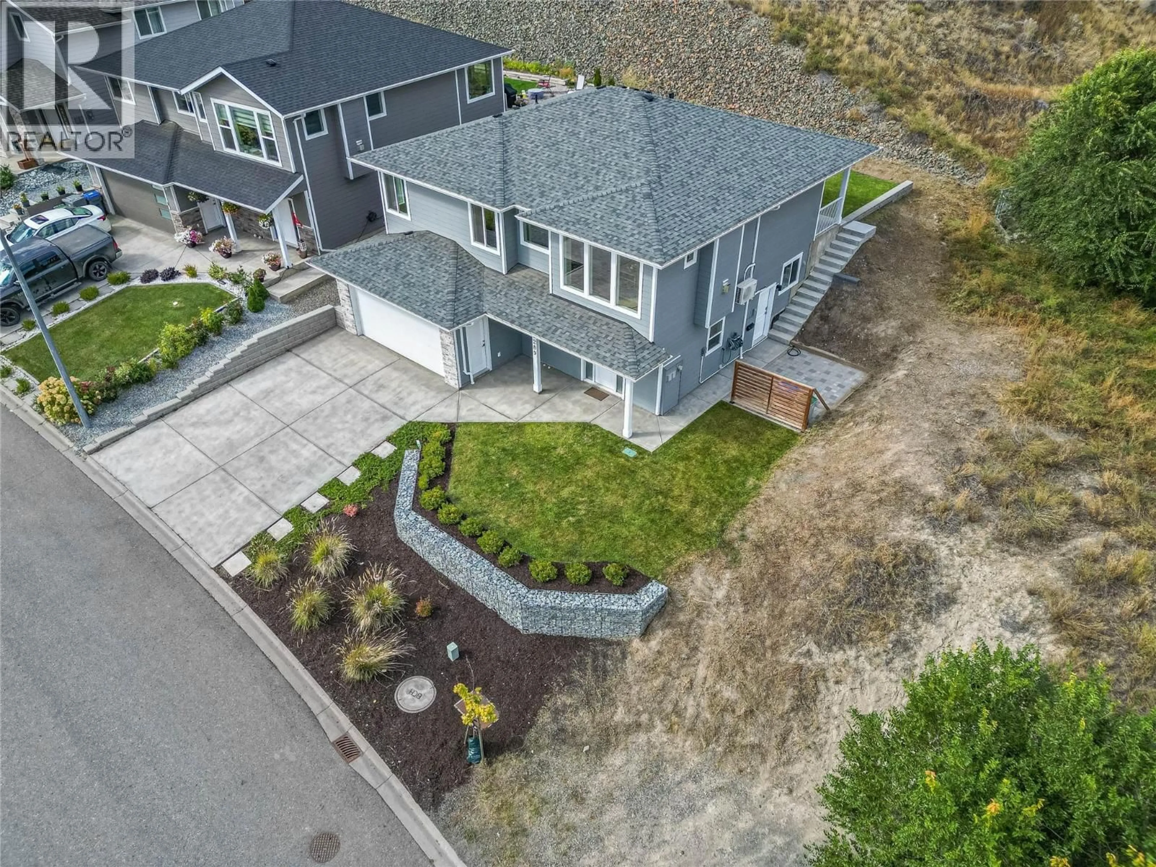 A pic from outside/outdoor area/front of a property/back of a property/a pic from drone, street for 2289 GRASSLANDS BOULEVARD, Kamloops British Columbia V2B0E3
