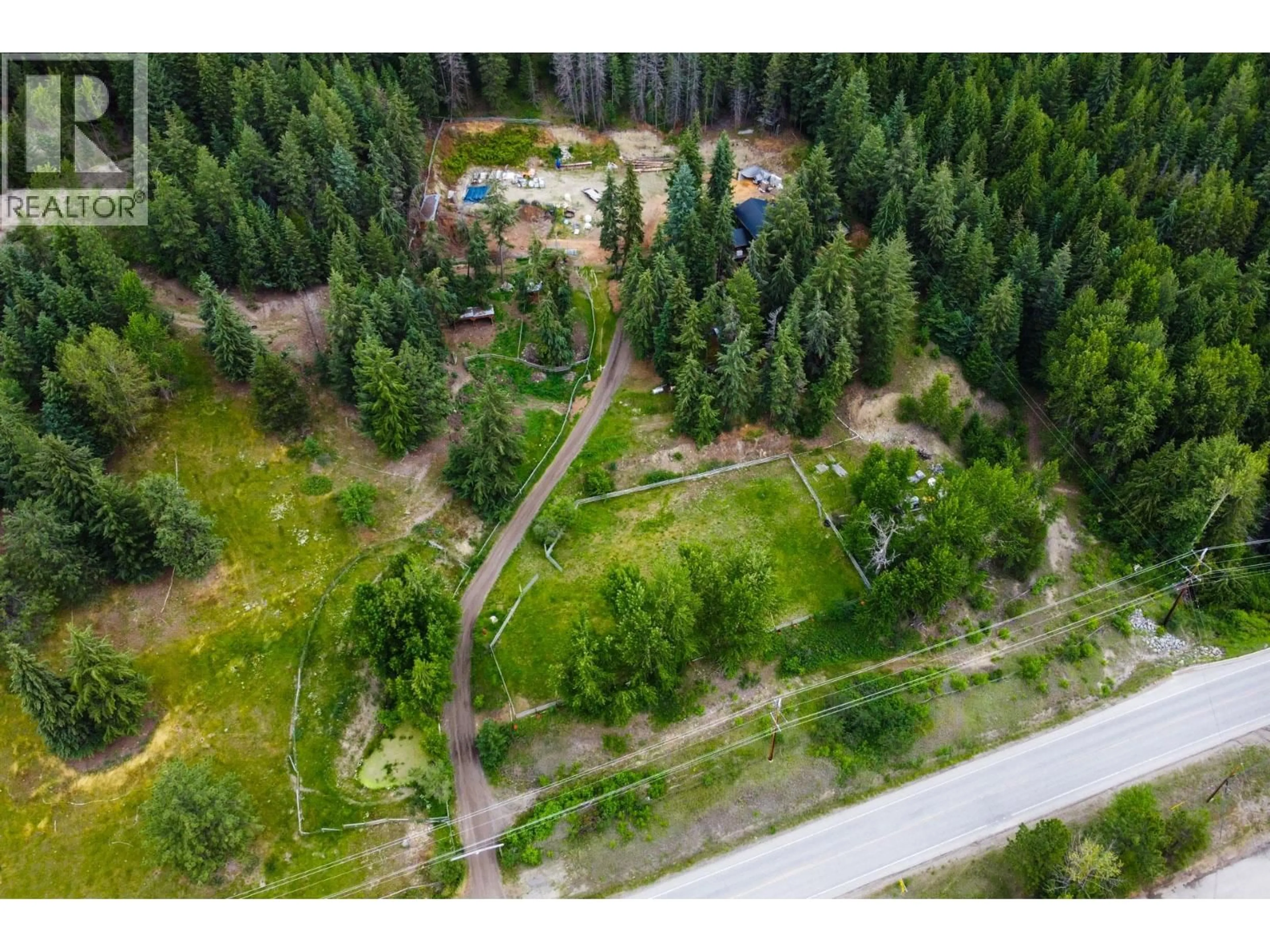 A pic from outside/outdoor area/front of a property/back of a property/a pic from drone, forest/trees view for 8600 33 HIGHWAY, Kelowna British Columbia V1P1J4