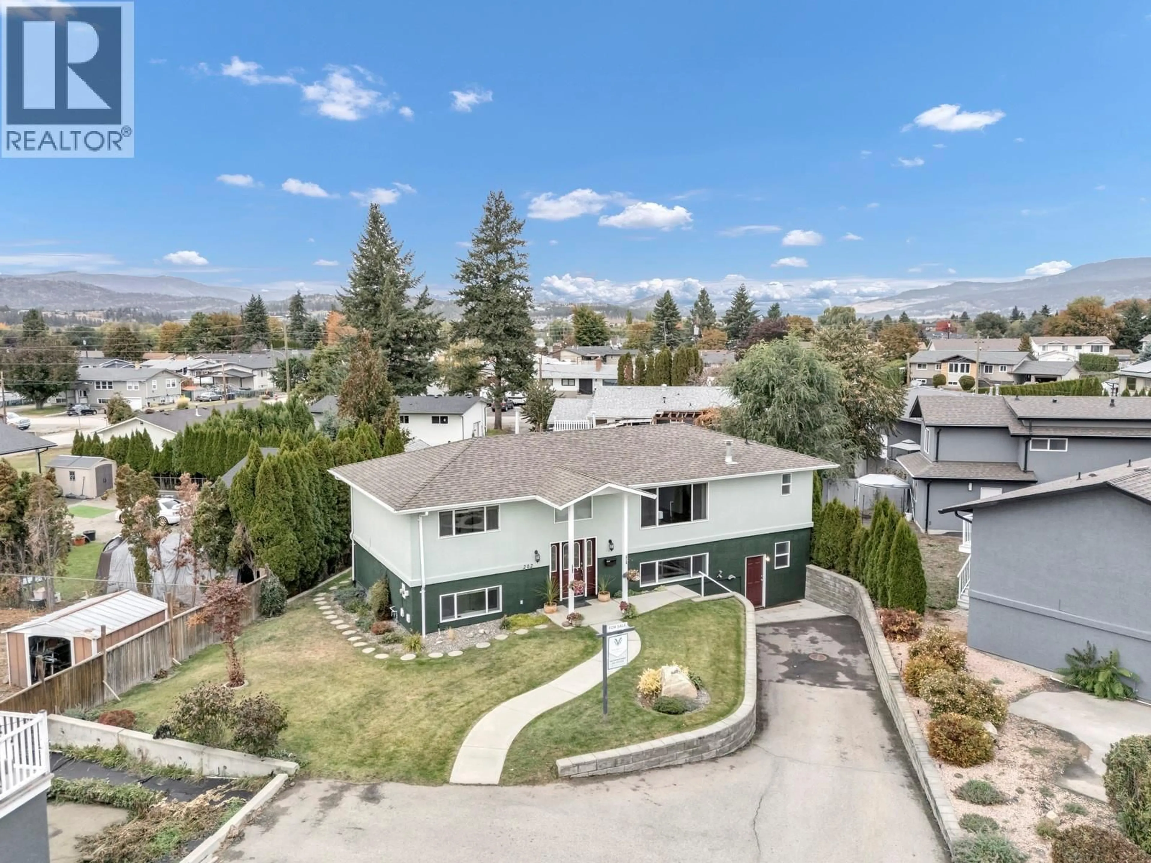 A pic from outside/outdoor area/front of a property/back of a property/a pic from drone, mountain view for 202 PEARSON ROAD, Kelowna British Columbia V1X7T6